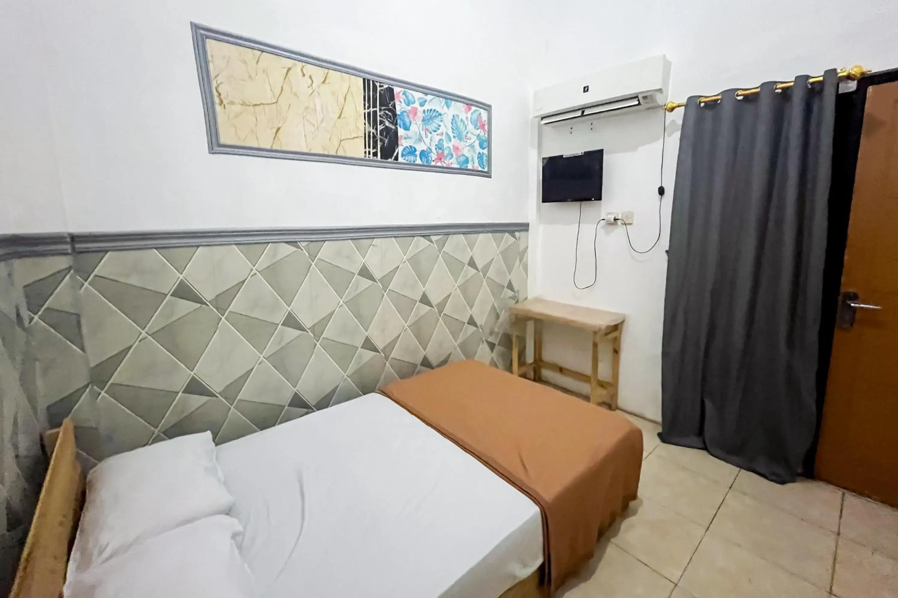 Standard Single Room in Forzando House Redpartner near Universitas Muhammadiyah Malang Standard Single Room in Forzando House Redpartner near Universitas Muhammadiyah Malang