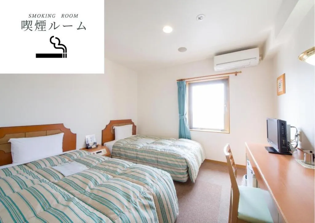 Bed in Hyper Hotel Komatsu