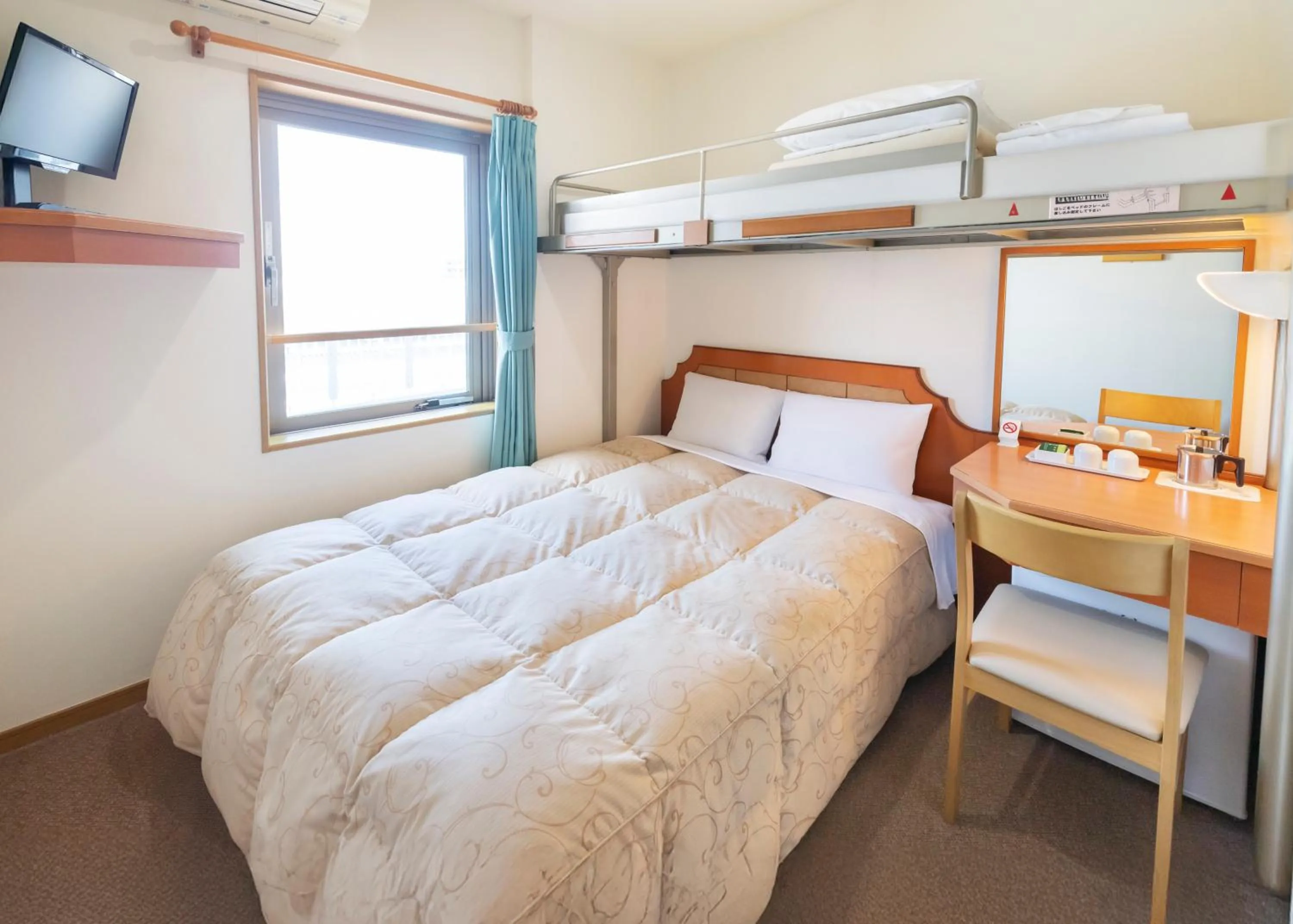 Bed in Hyper Hotel Komatsu