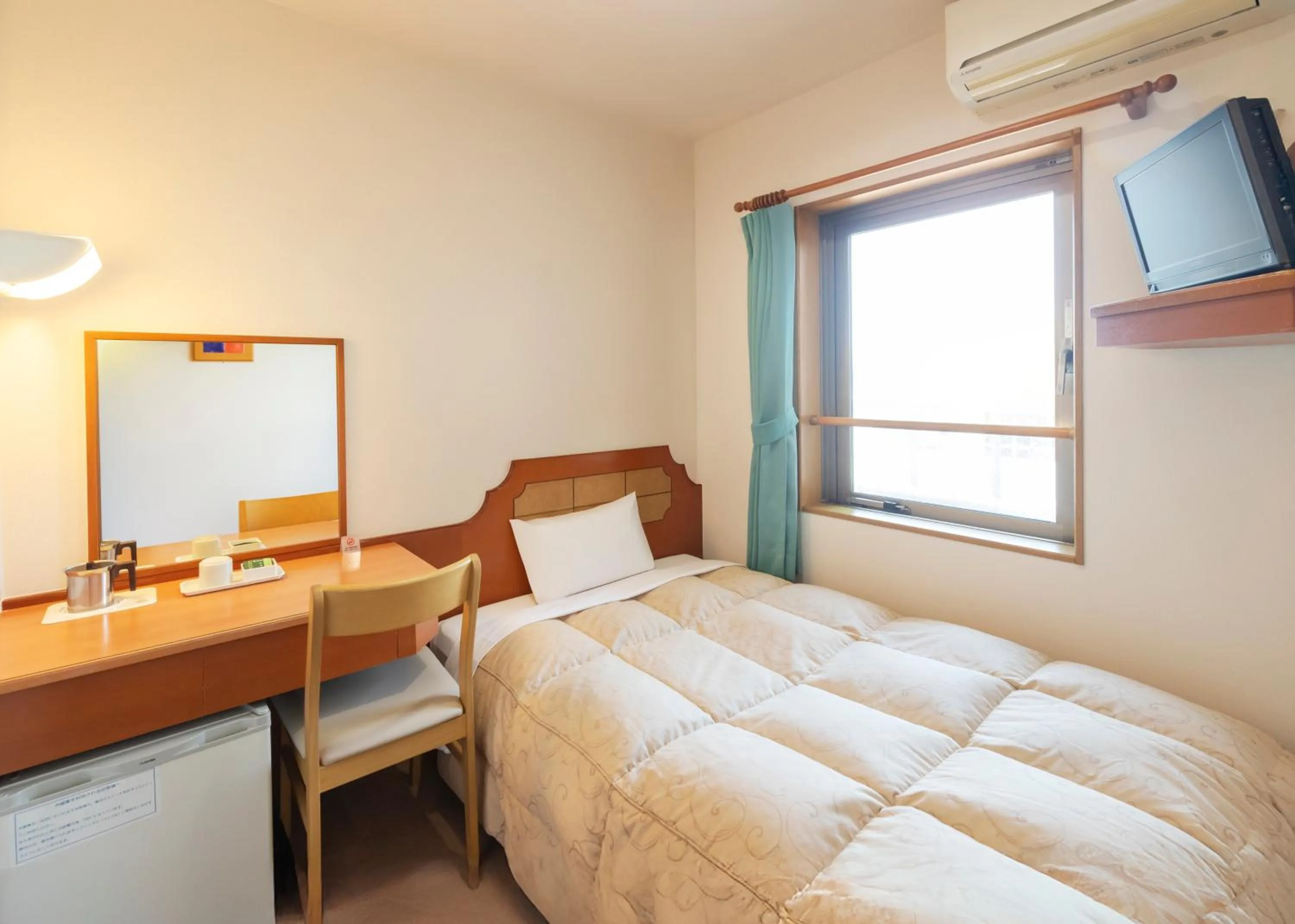 Bed in Hyper Hotel Komatsu