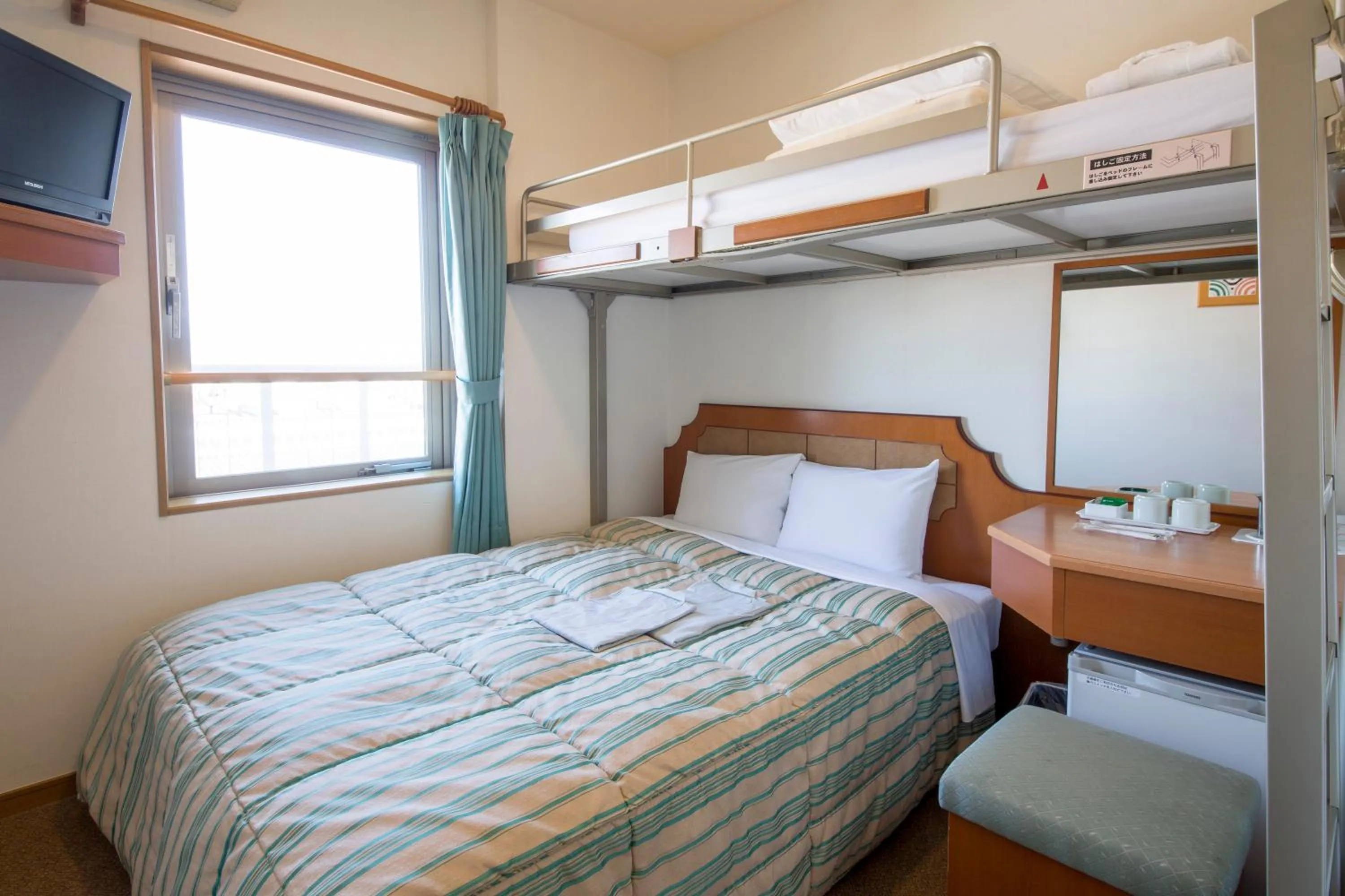 Bed in Hyper Hotel Komatsu