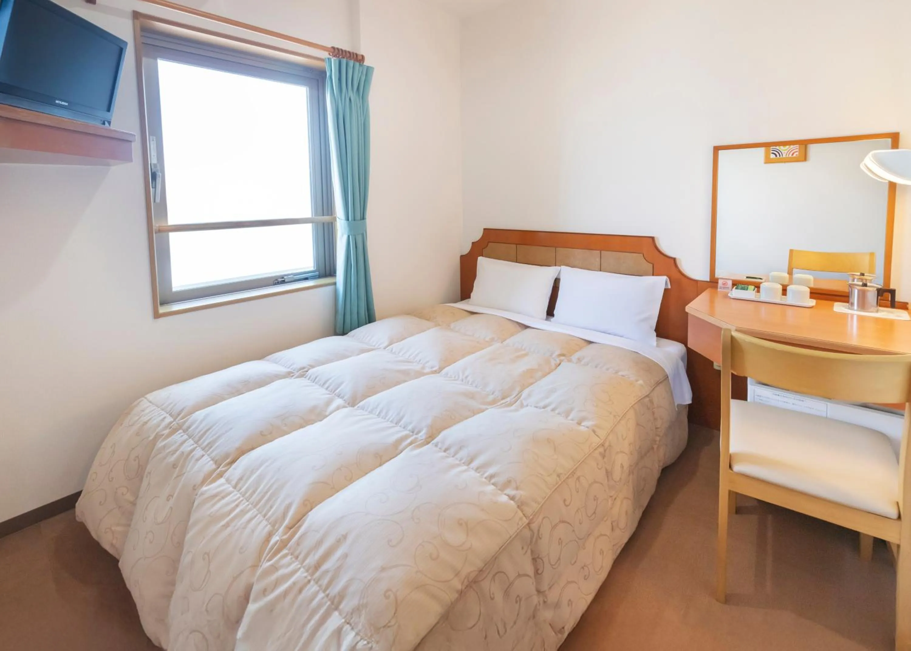 Bed in Hyper Hotel Komatsu