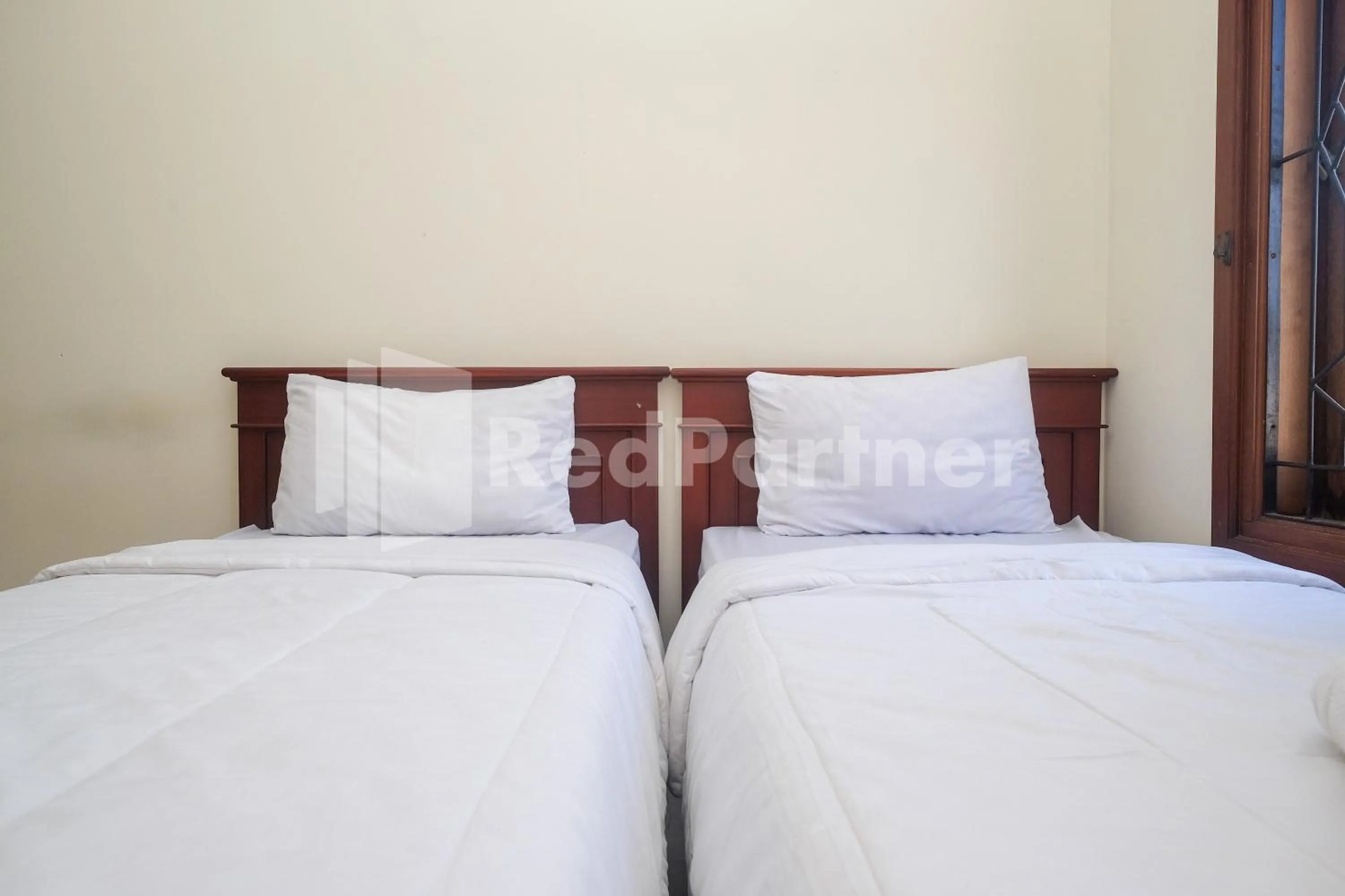 Bed in Griya Fatima Mitra RedDoorz near UGM