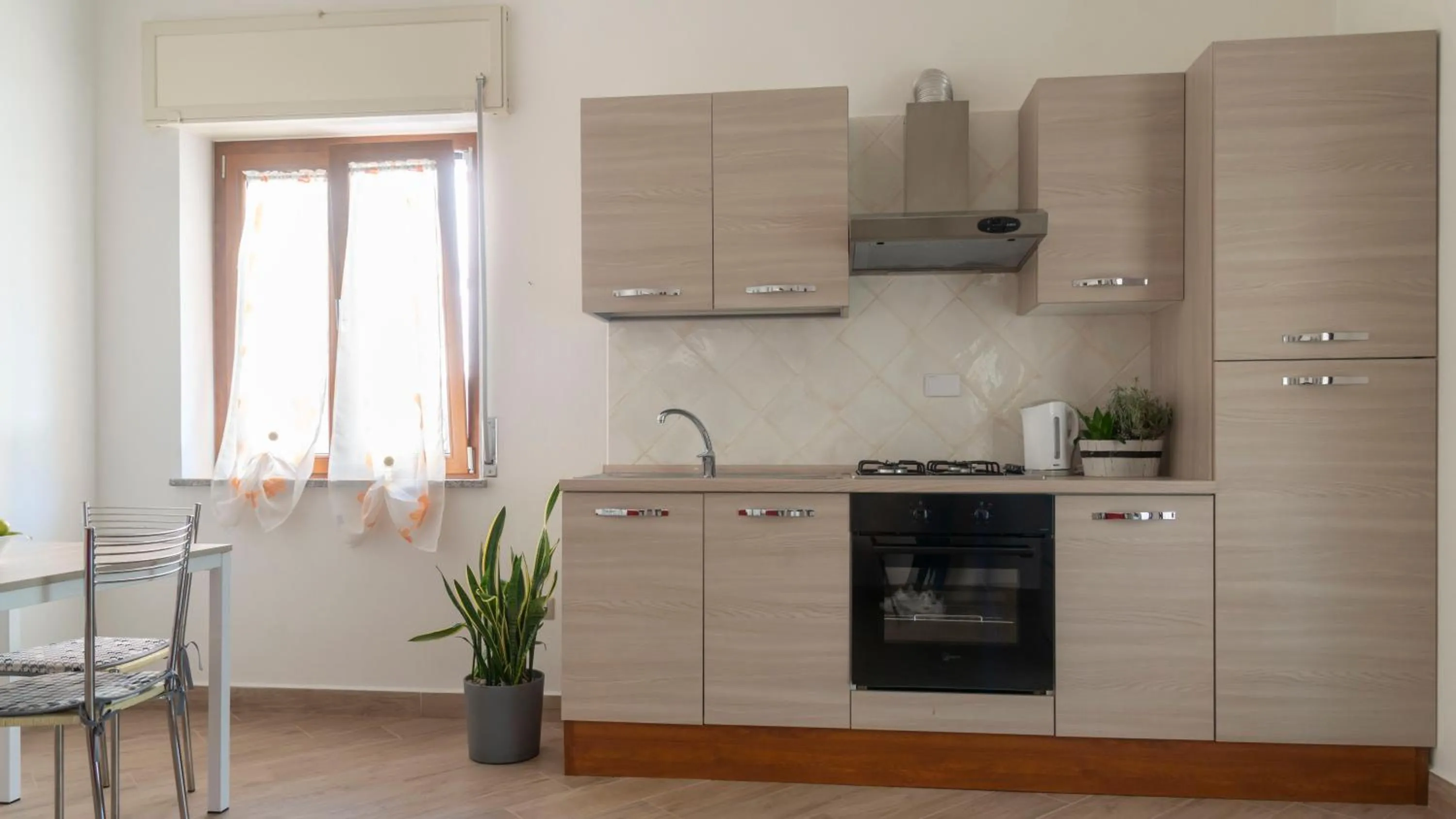 Kitchen or kitchenette in Casa Dei Lecci - Cala Gonone