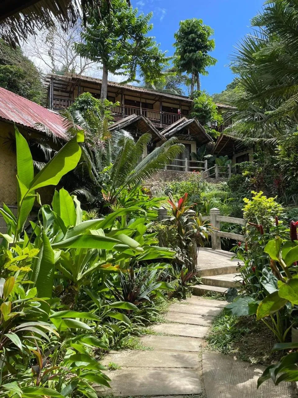 Garden view, Property Building in Novie's Tourist Inn
