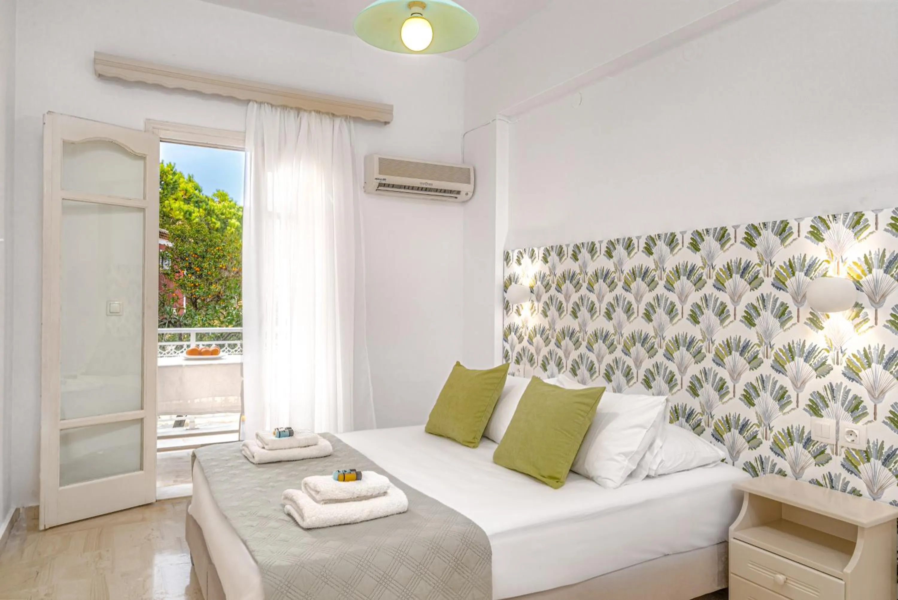 Bed in Pyrgaraki Studios and Apartments