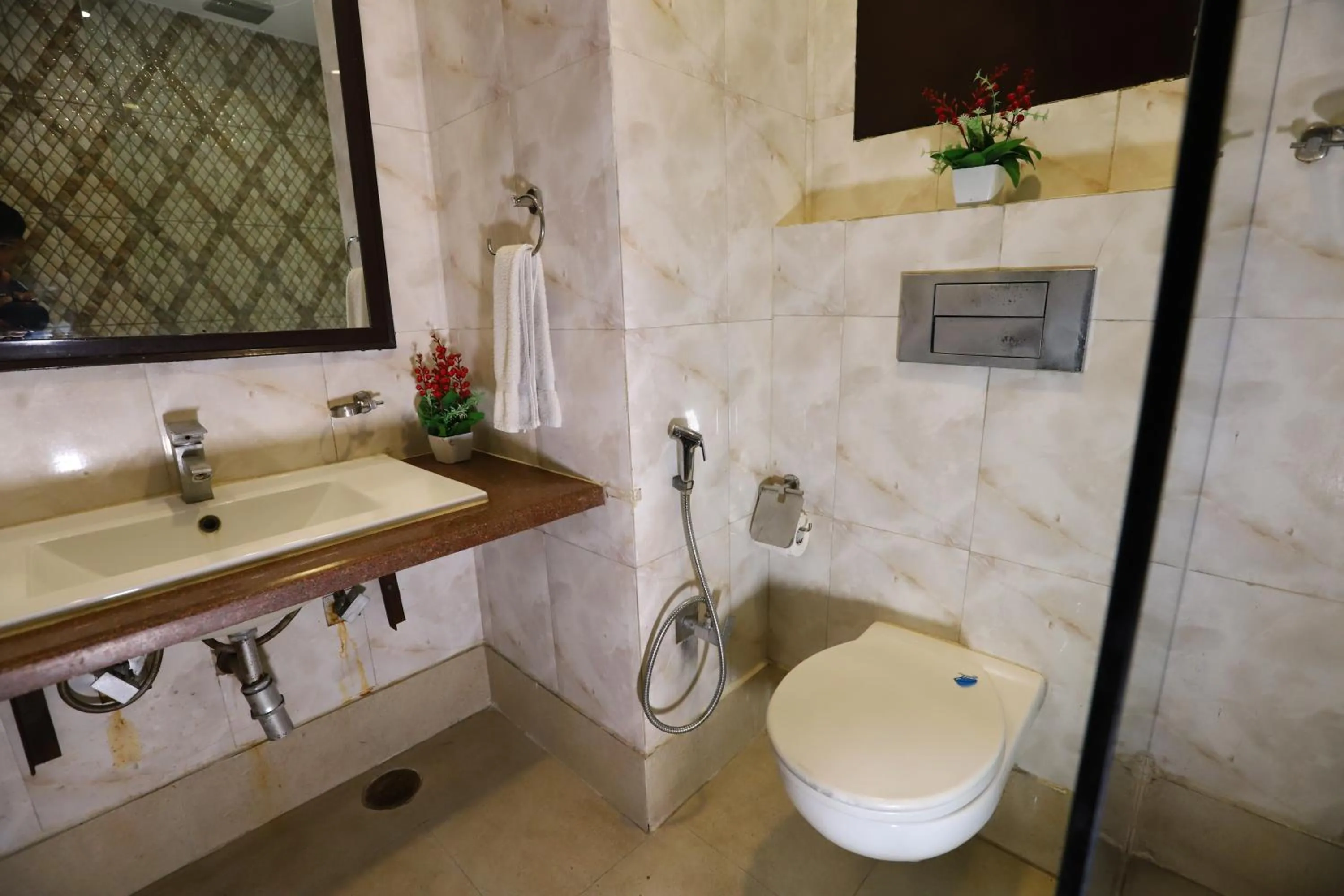 Bathroom in Hotel Palm Grand Naraina New Delhi - Couple Friendly Local IDs Accepted