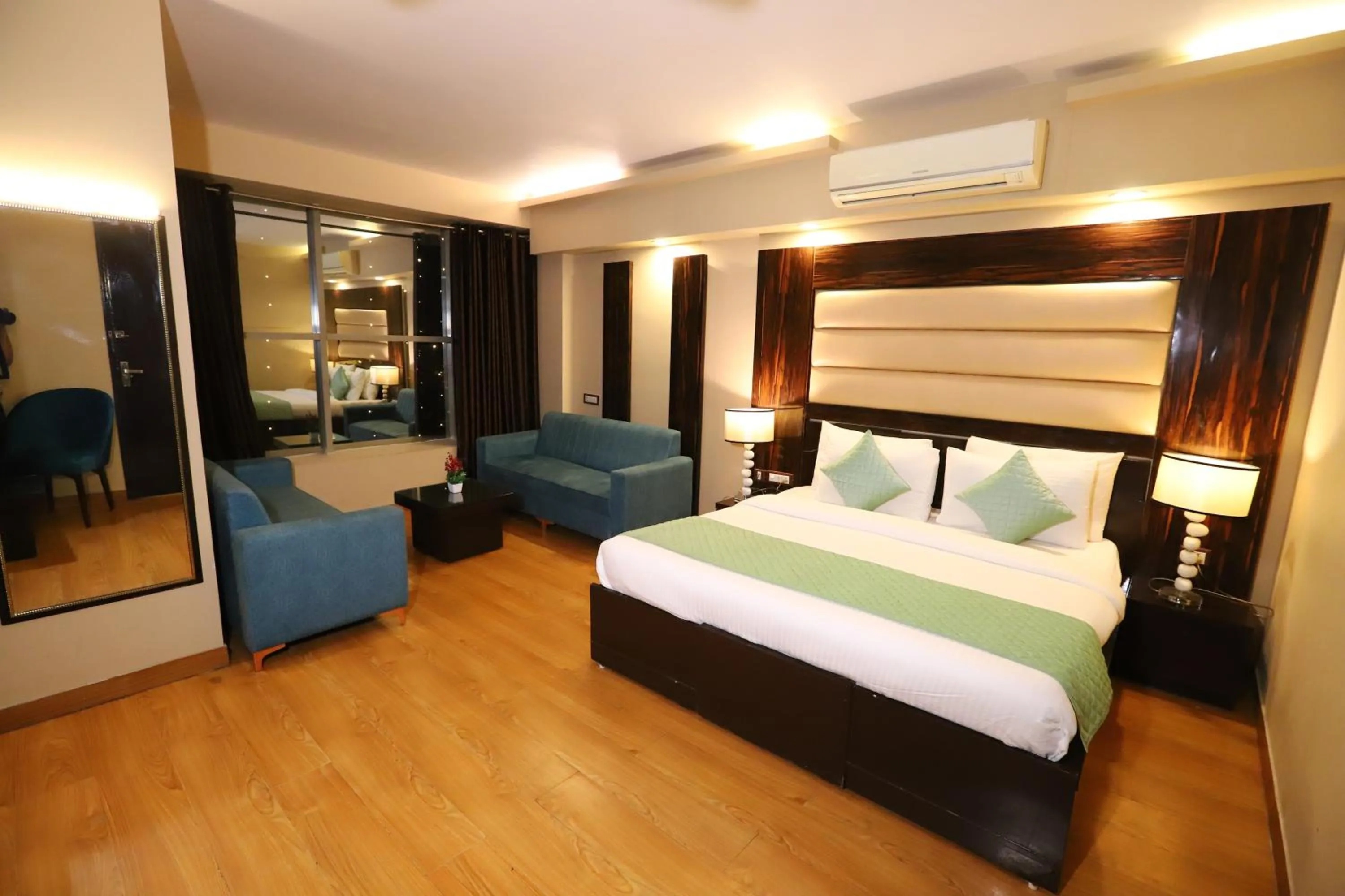 Photo of the whole room, Bed in Hotel Palm Grand Naraina New Delhi - Couple Friendly Local IDs Accepted