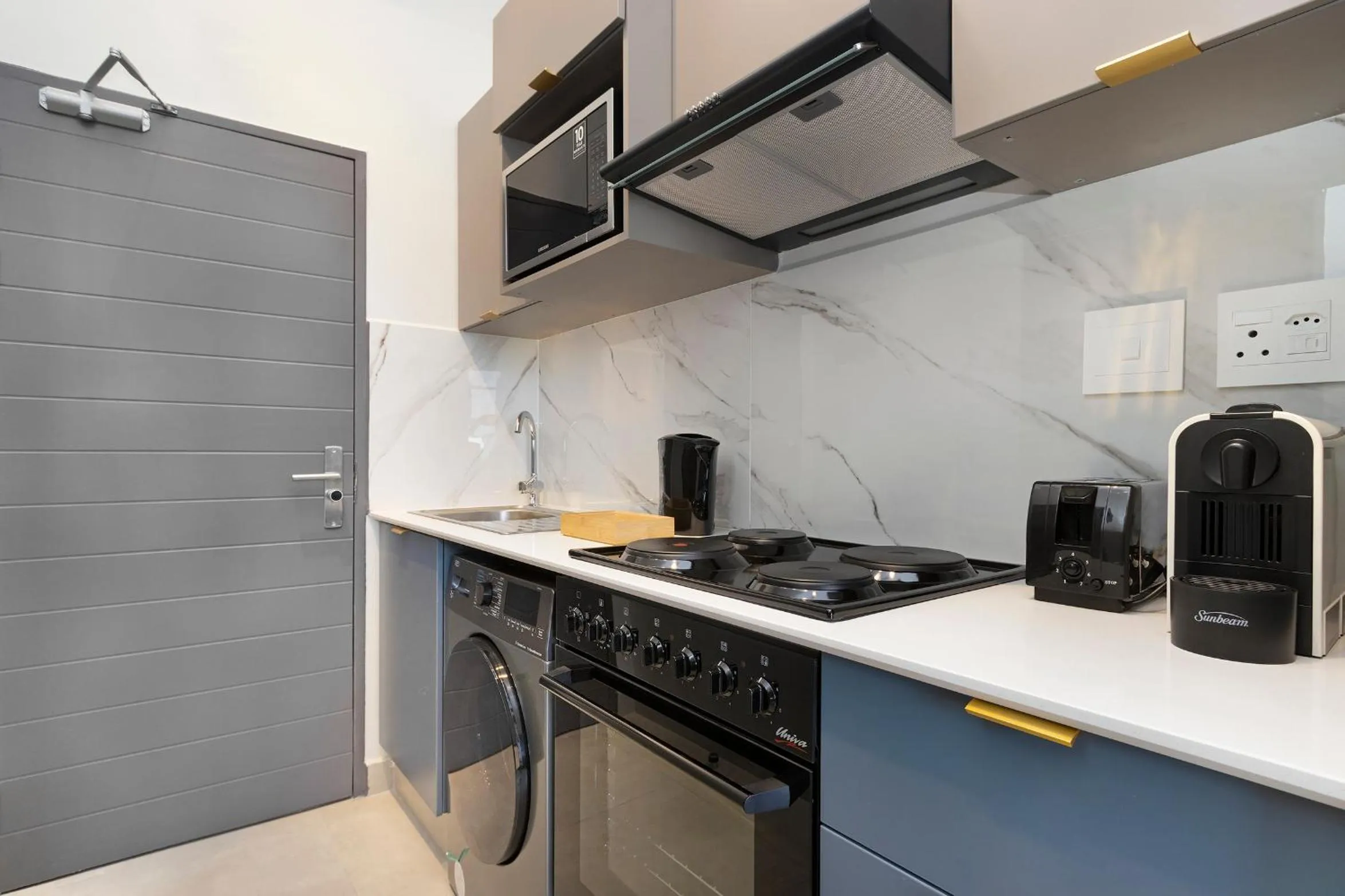 kitchen in The Archer Aparthotel by Totalstay