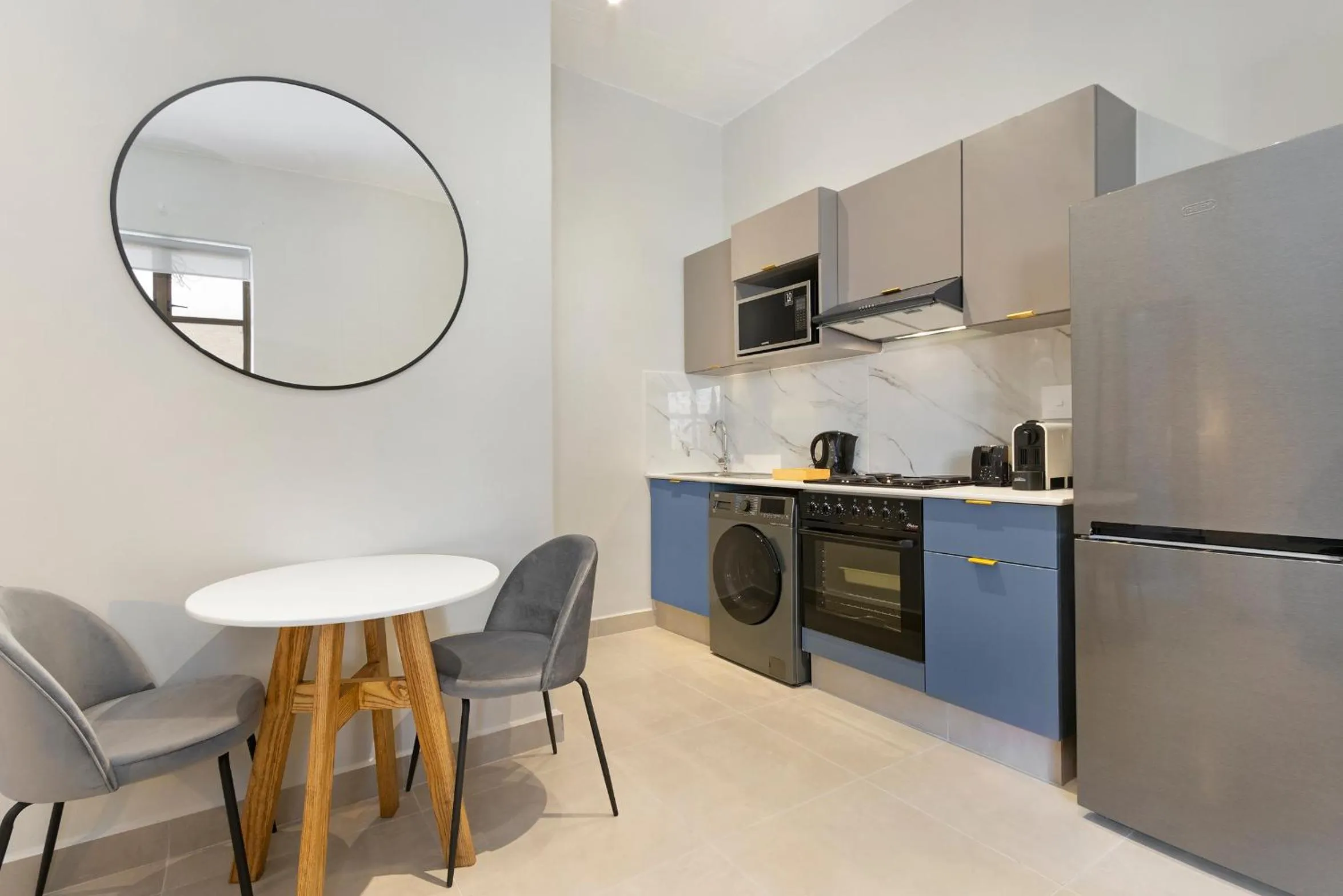 Kitchen or kitchenette in The Archer Aparthotel by Totalstay