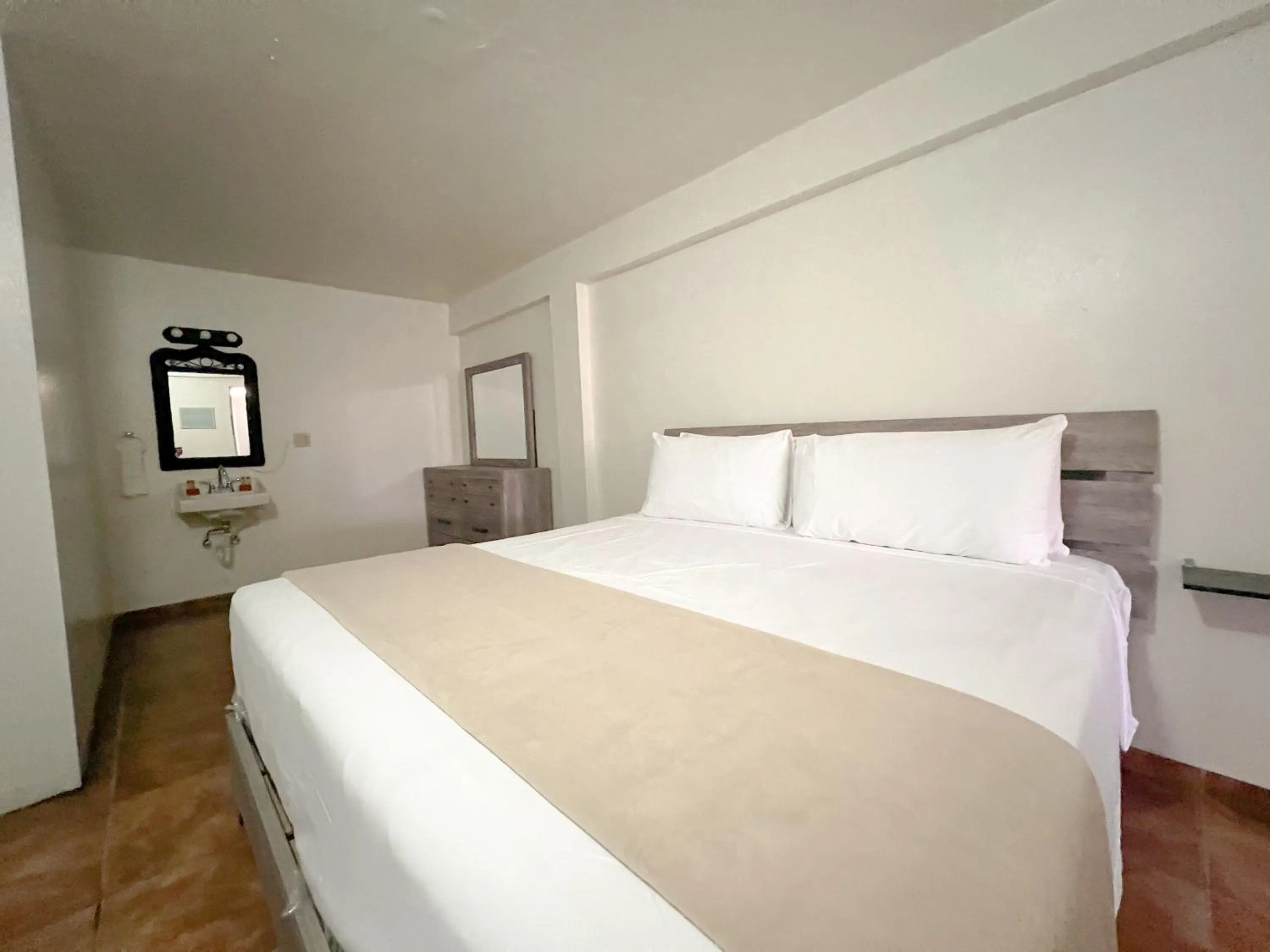 Bedroom in West Coast Inn's