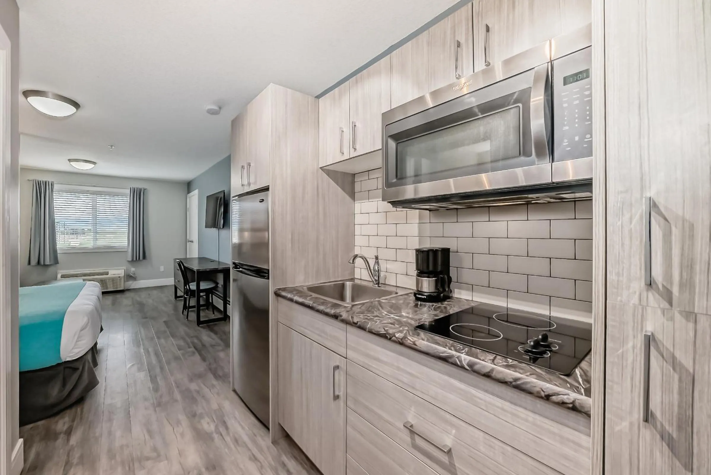 Kitchen or kitchenette in The Suites, INN Hotels