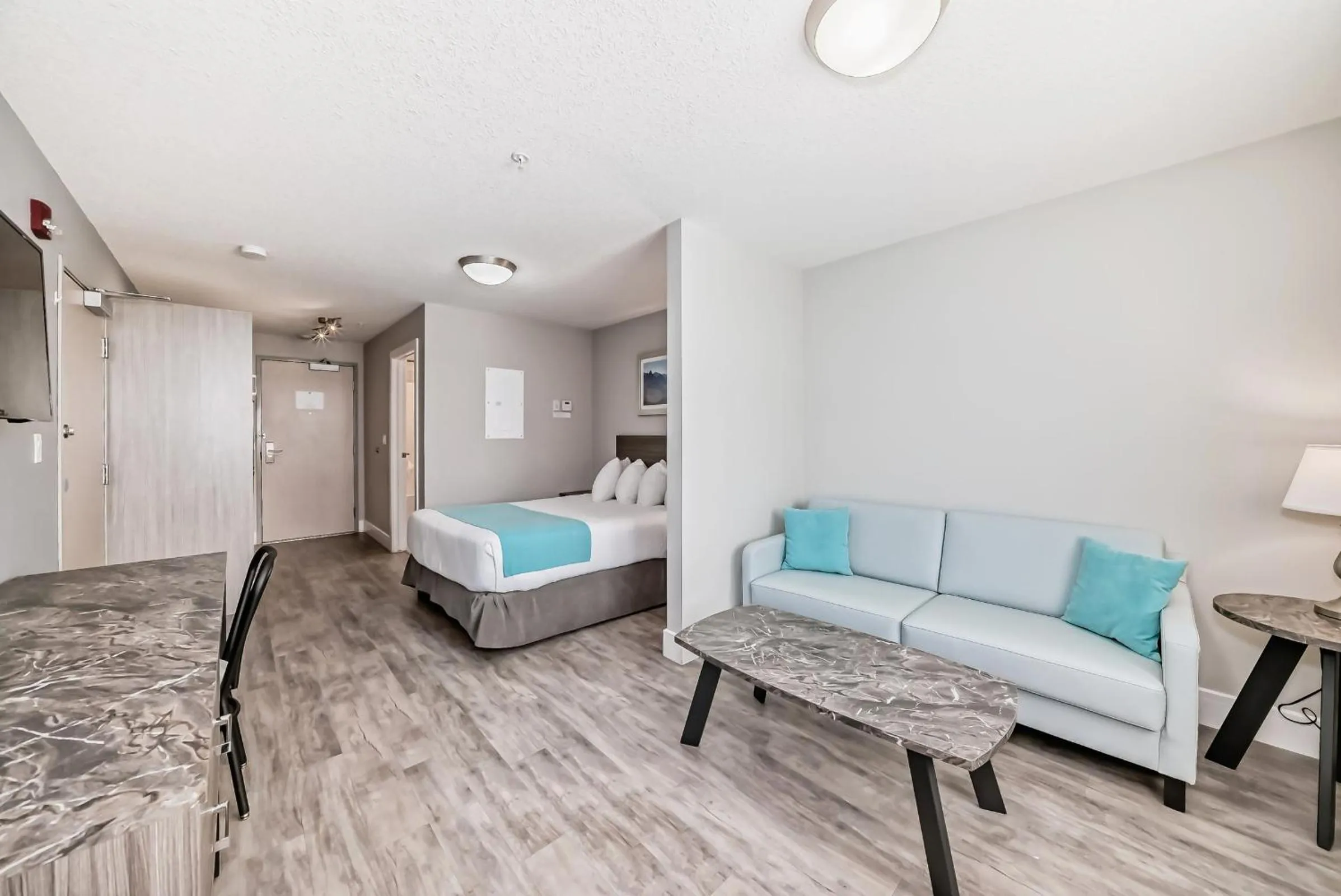 Living room in The Suites, INN Hotels