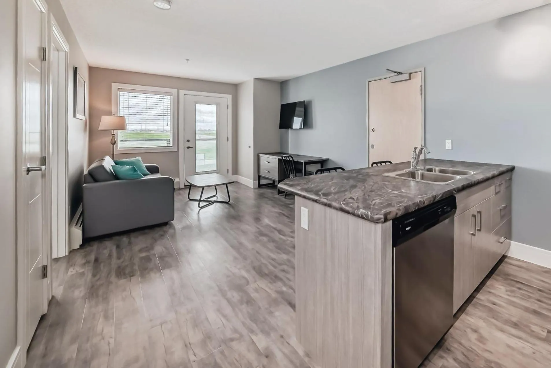 Living room in The Suites, INN Hotels