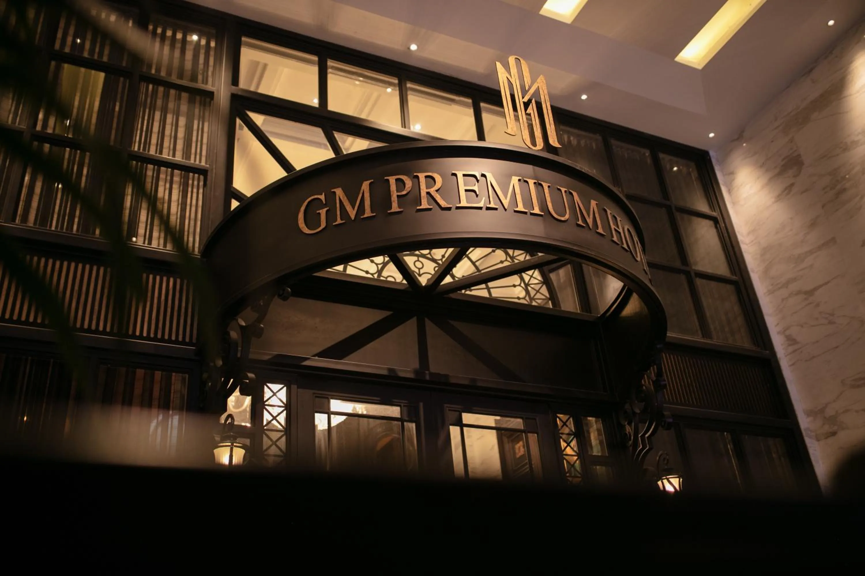 Property logo or sign in GM Premium Hotel