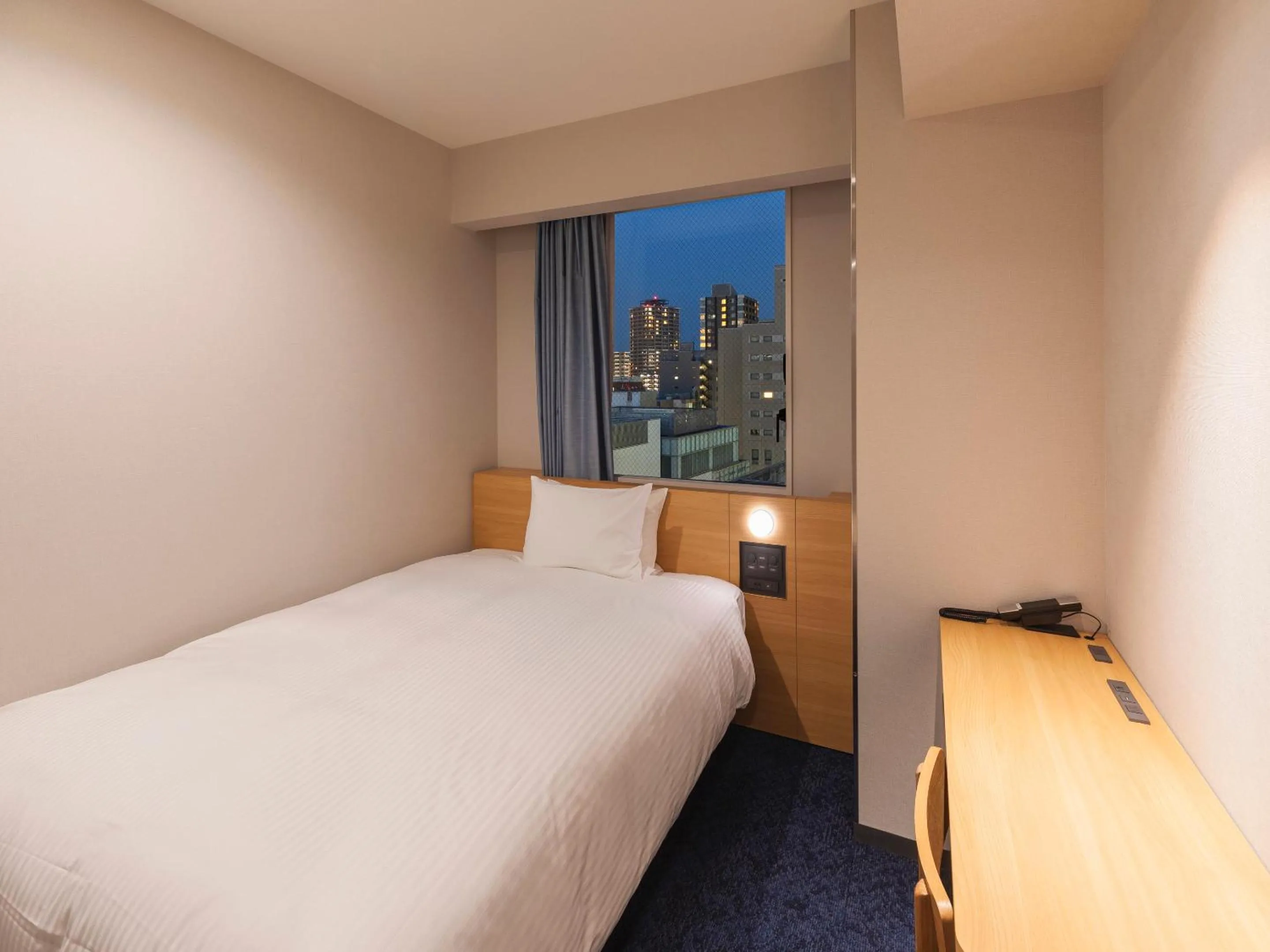 Bed in Sotetsu Fresa Inn Sendai