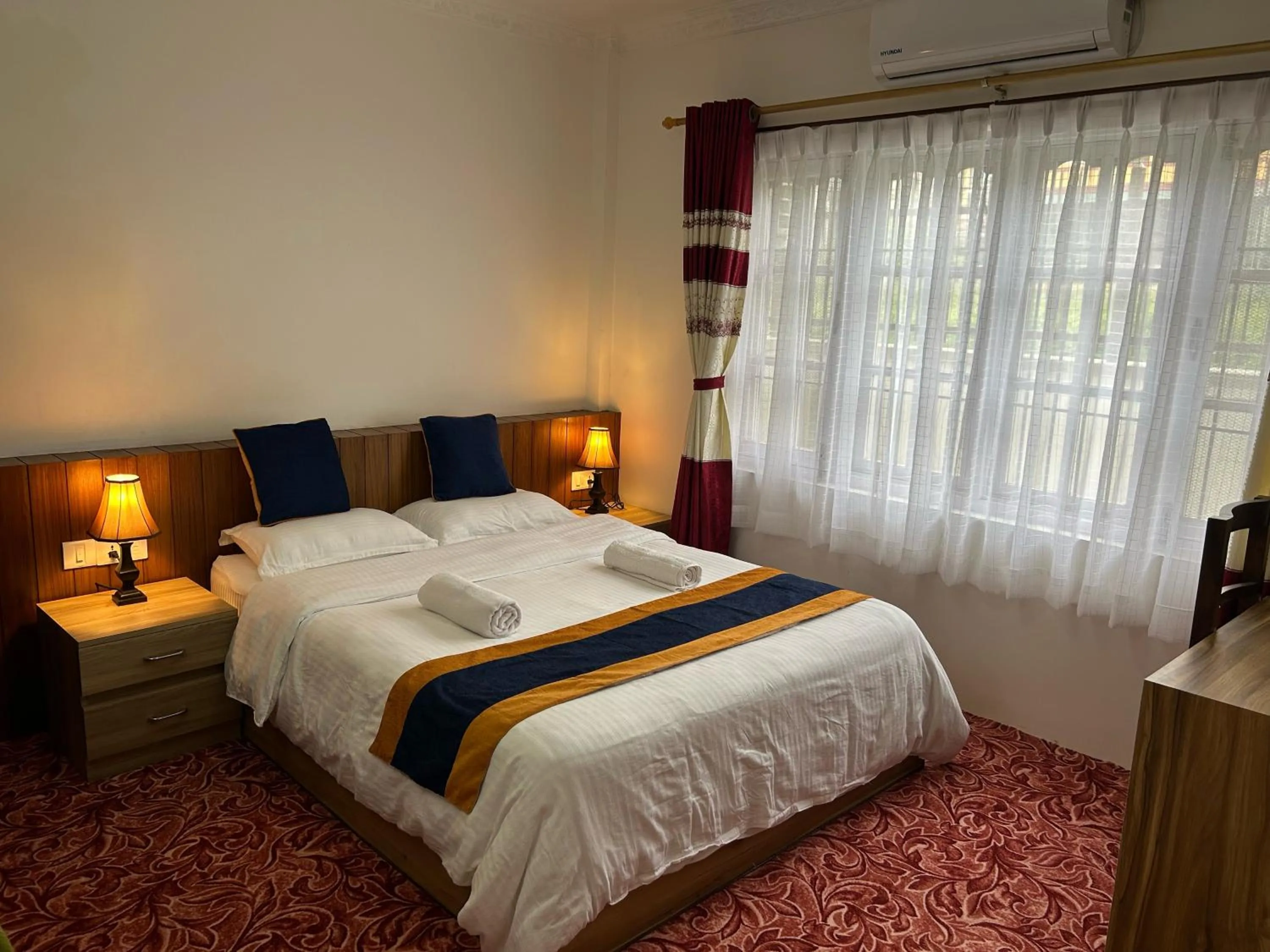 Bedroom, Bed in Raniban Suites - Apartment Home