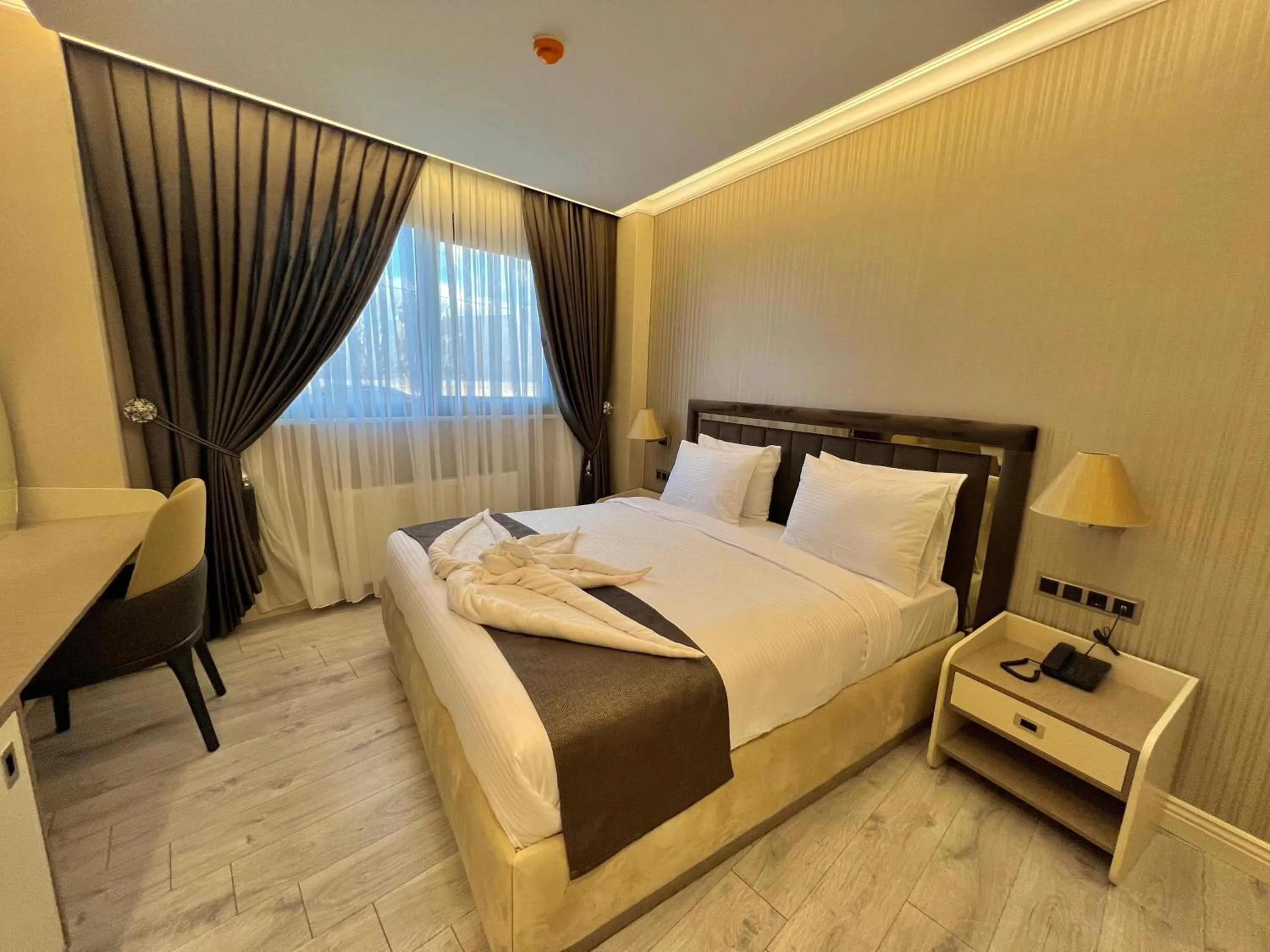 Bed in MQ Hotel Suites & SPA