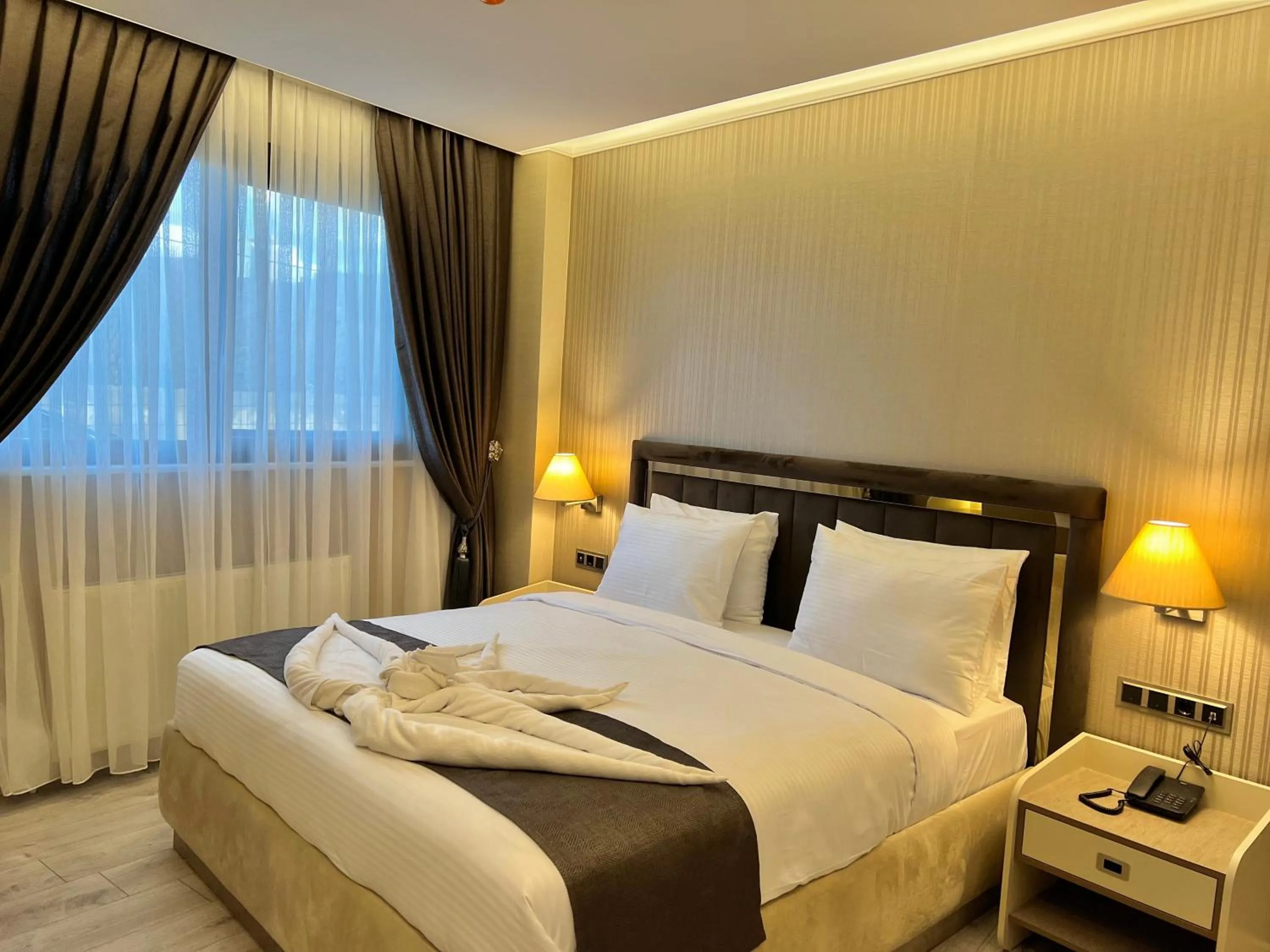 Bed in MQ Hotel Suites & SPA