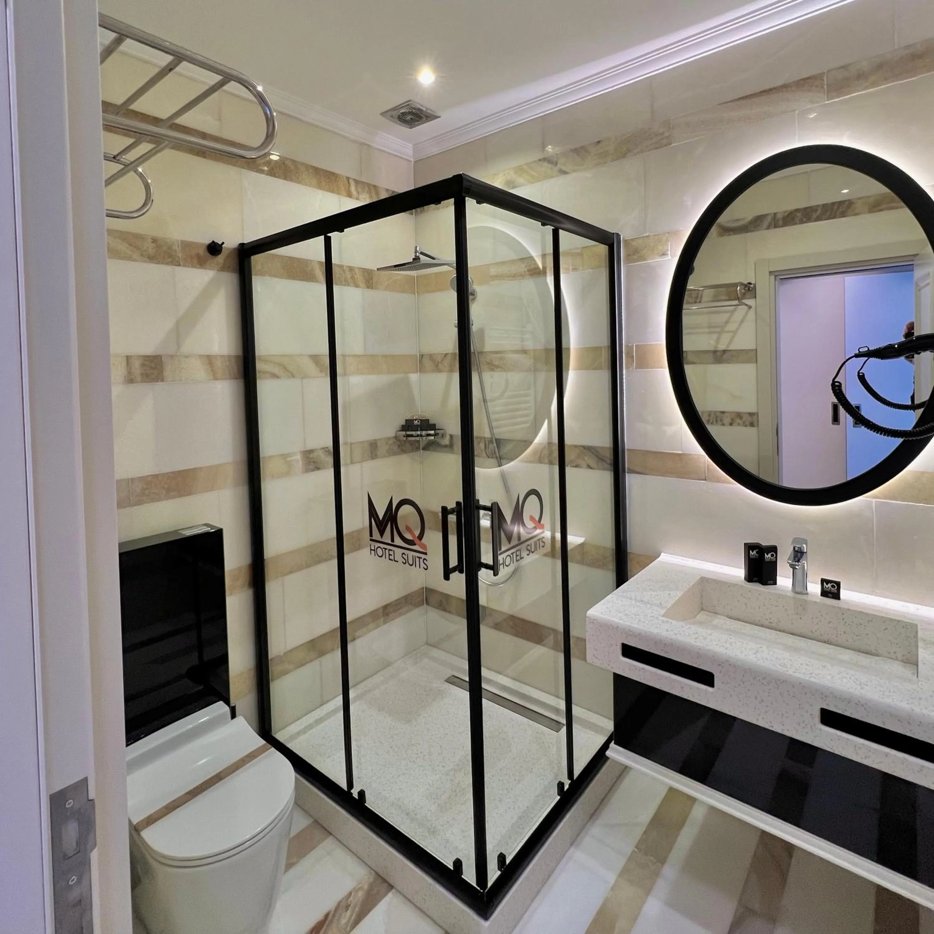 Property logo or sign in MQ Hotel Suites & SPA