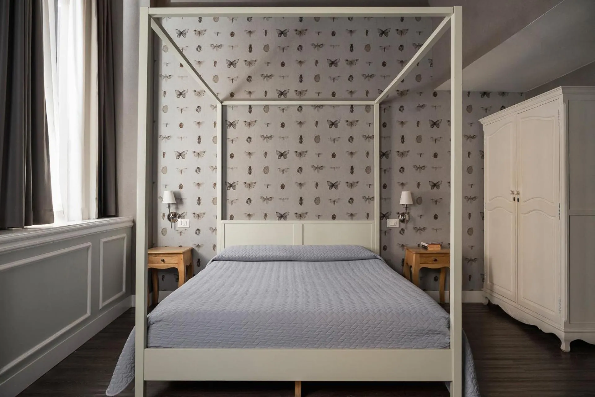 Bed in Maxxim Hotel & Loft