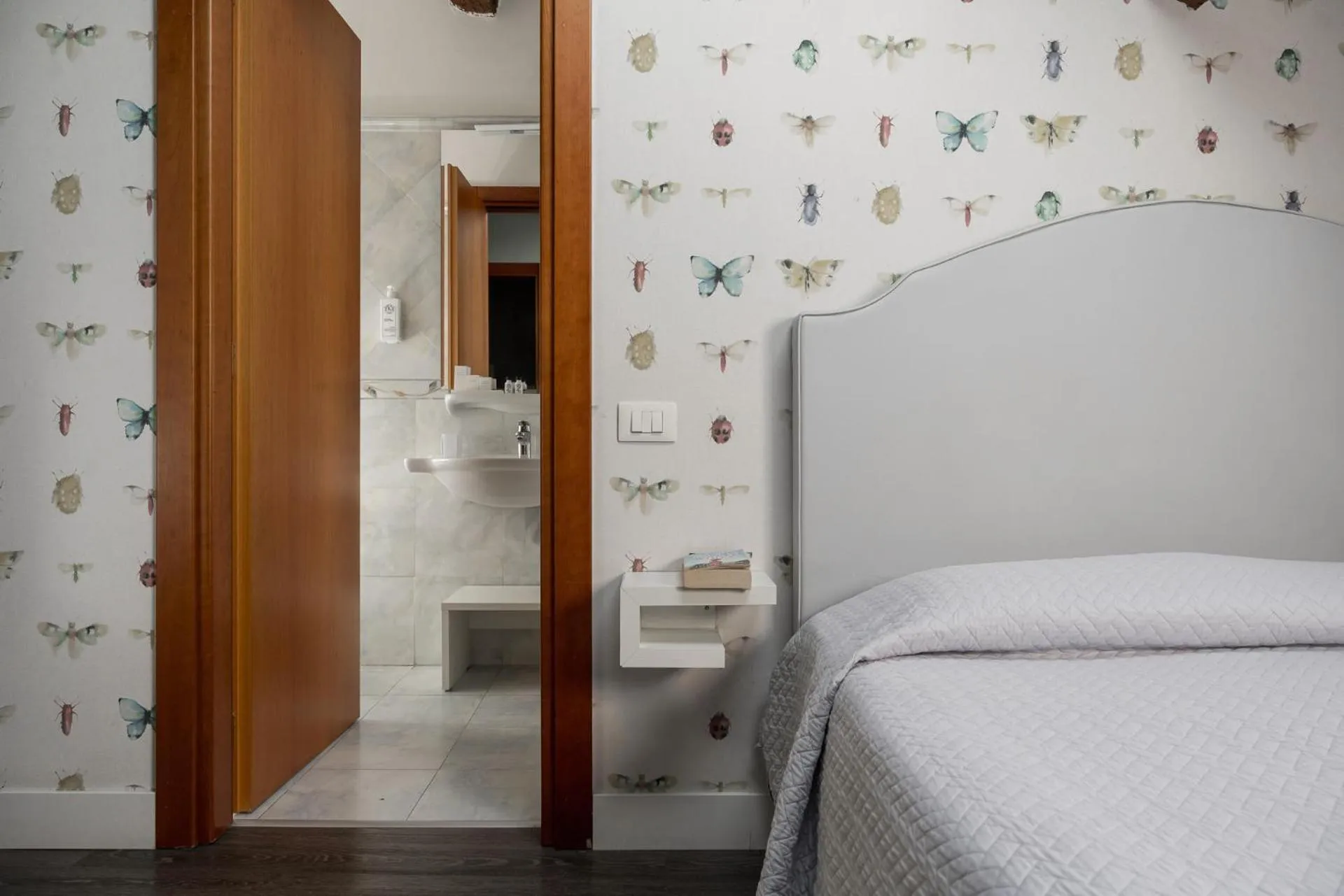 Bed in Maxxim Hotel & Loft