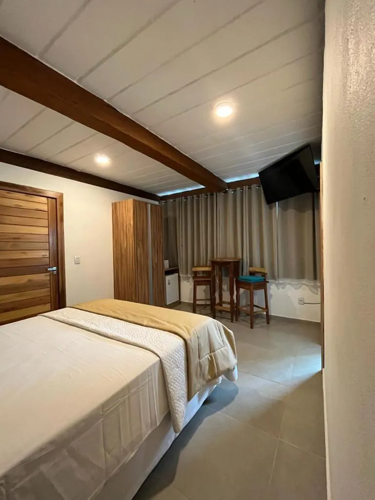 Bed in Pousada Mar Mineiro Macacos