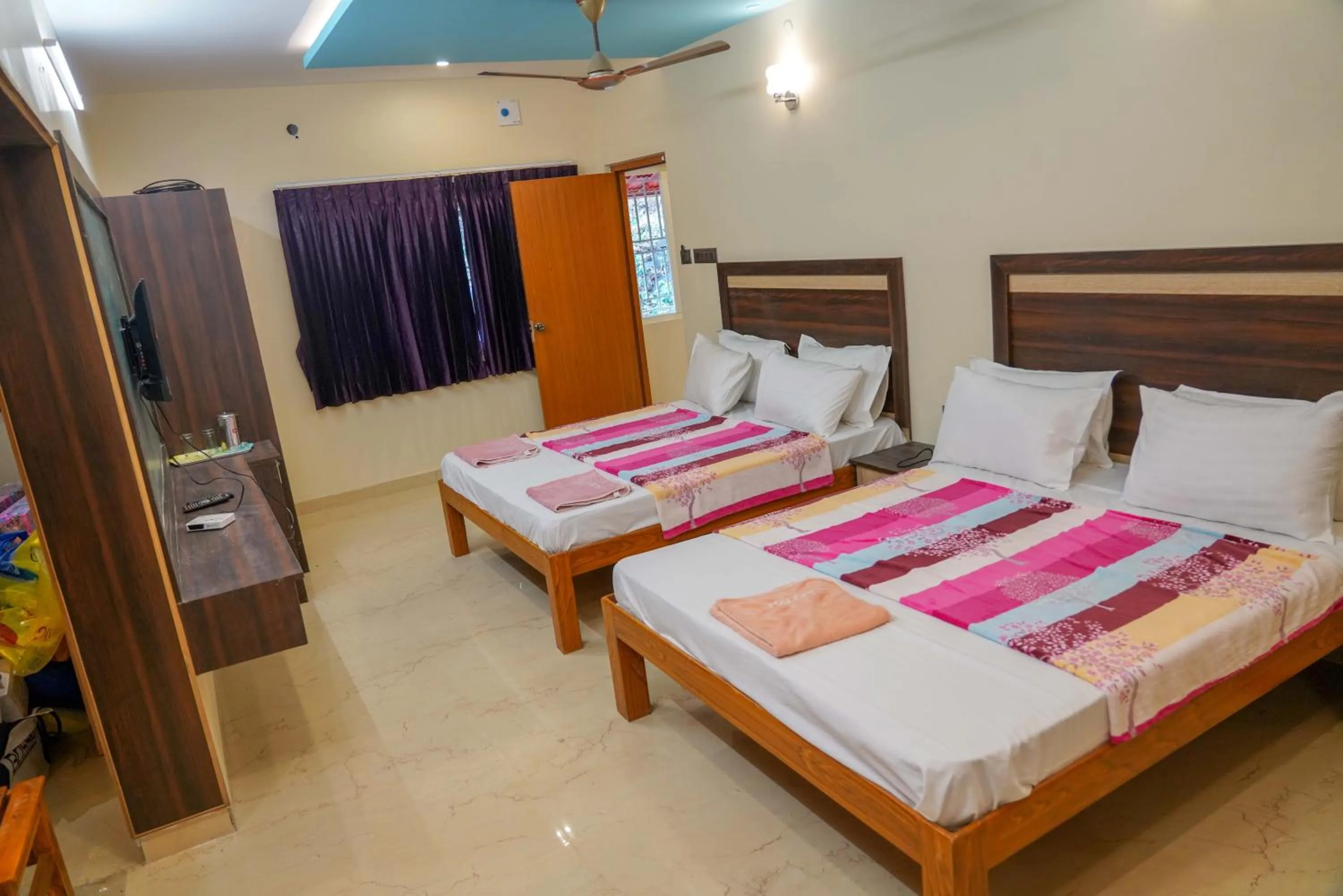 Bed in Bhavan Resorts
