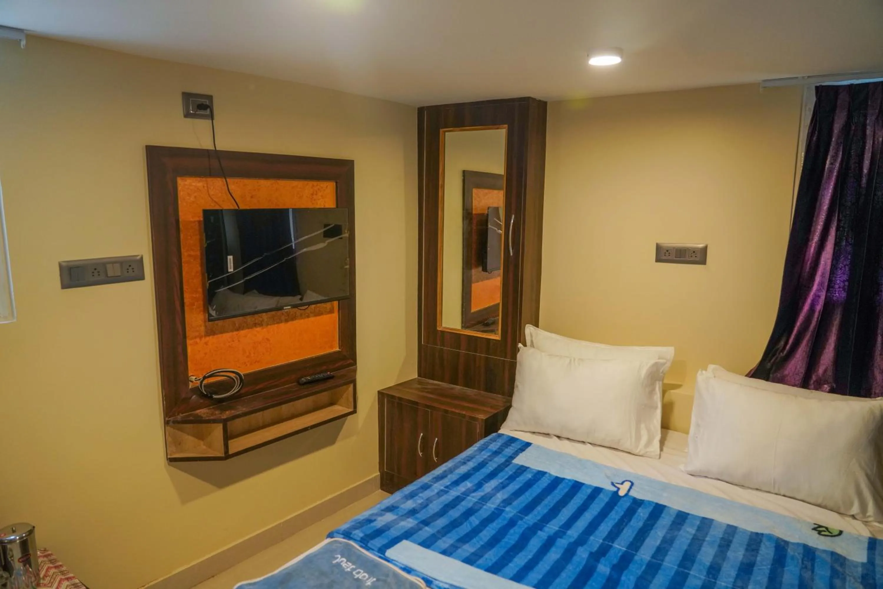 Bed in Bhavan Resorts