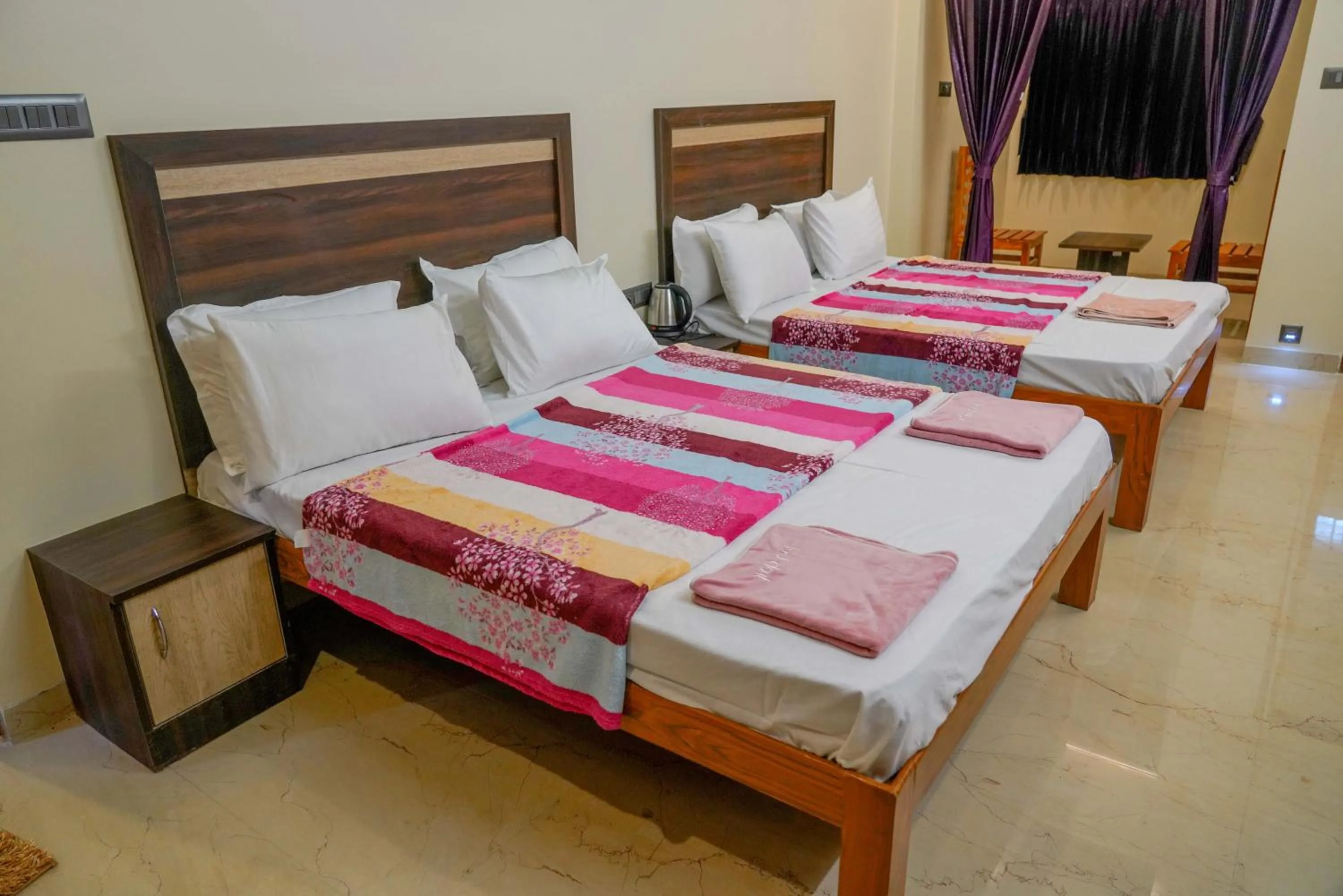 Bed in Bhavan Resorts
