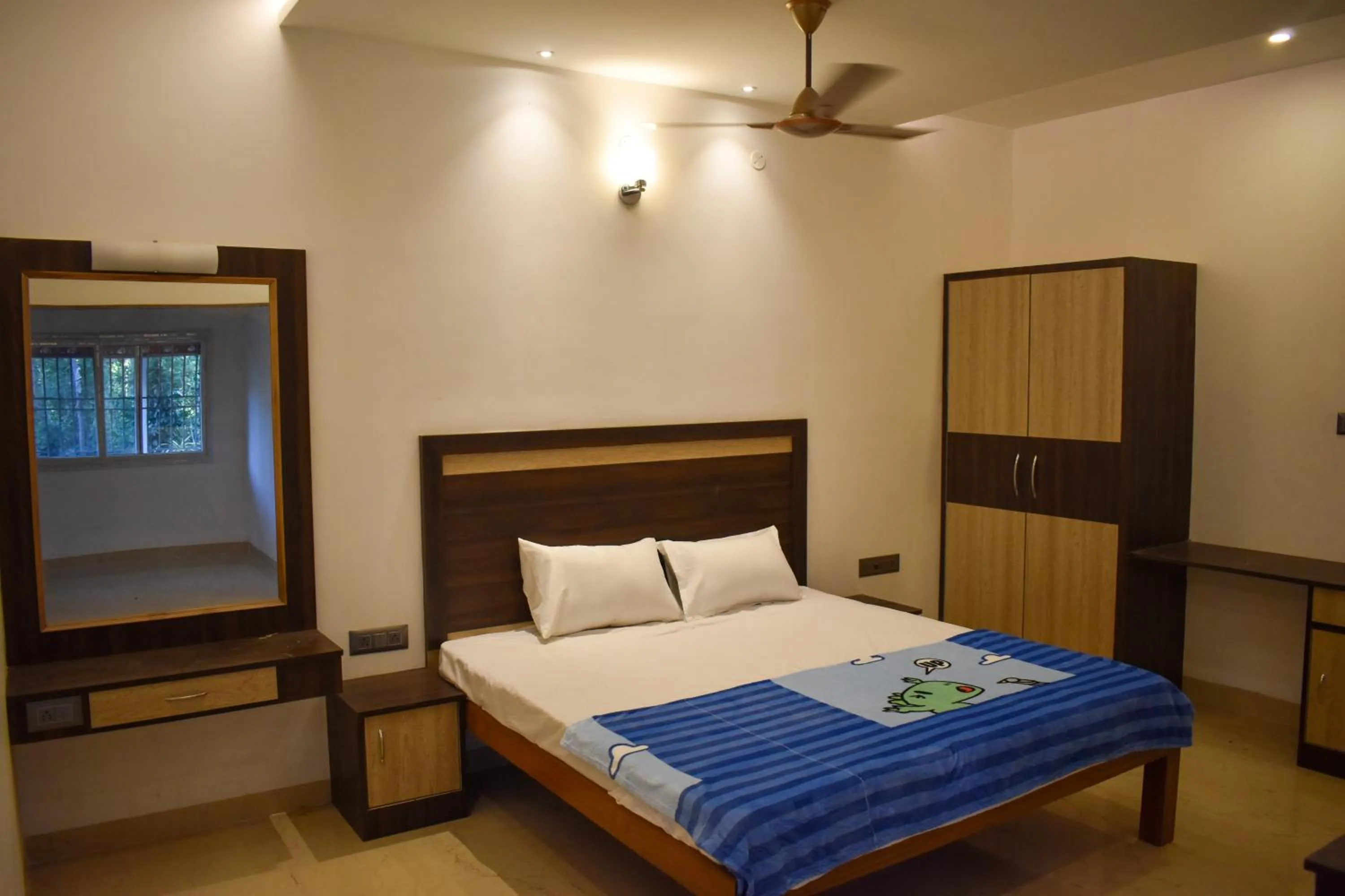 Bed in Bhavan Resorts