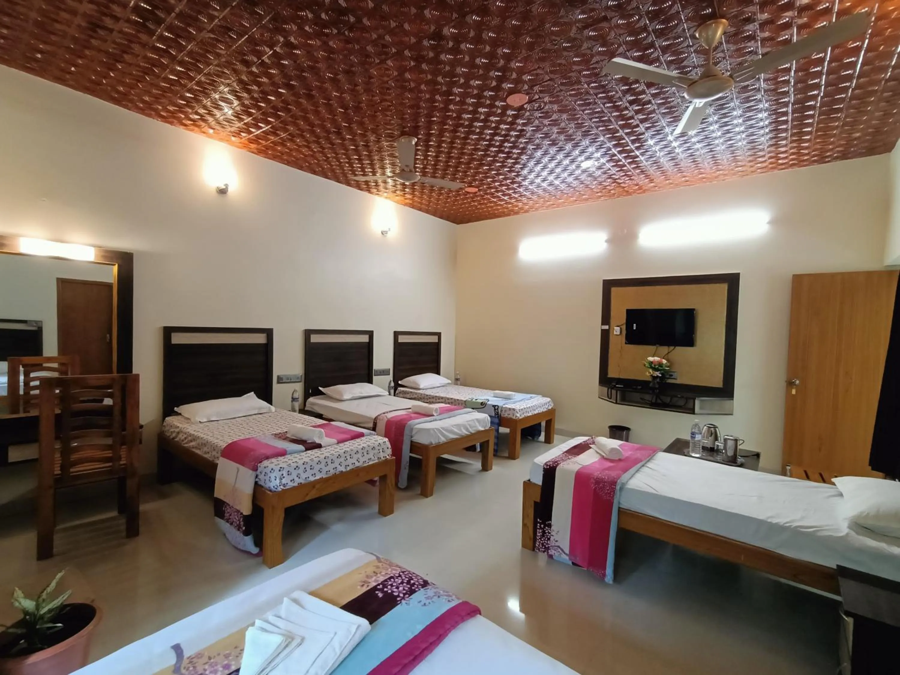 Bed in Bhavan Resorts