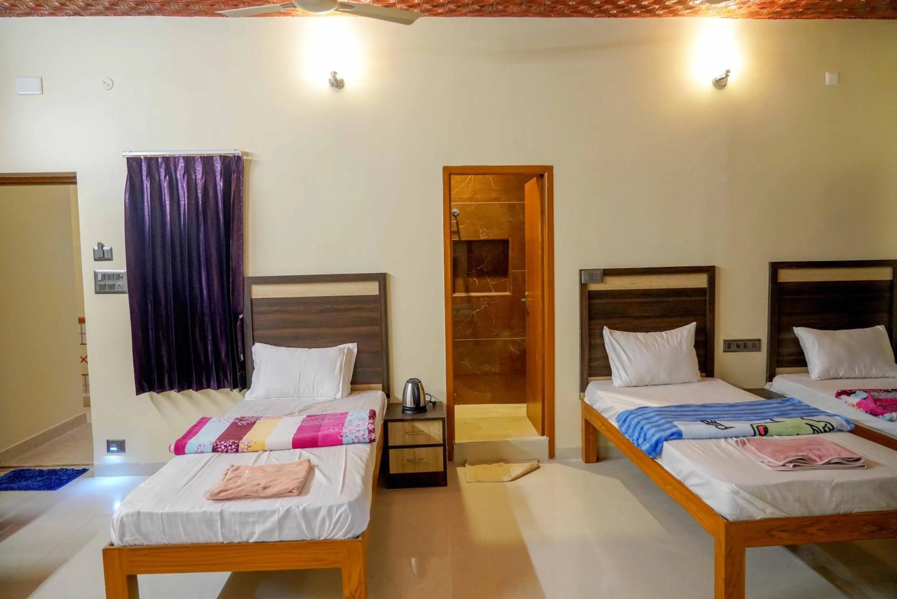 Bed in Bhavan Resorts