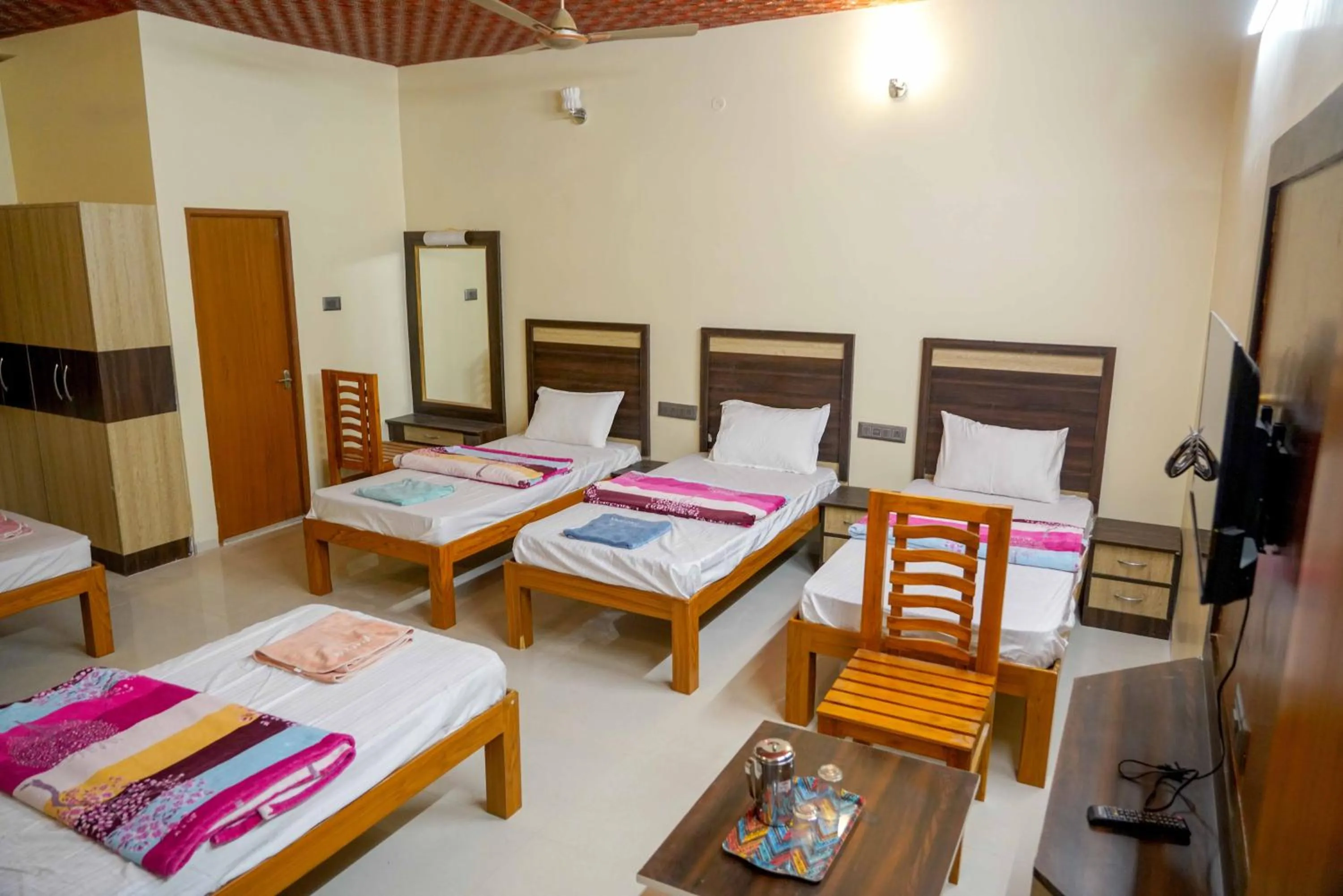 Bed in Bhavan Resorts