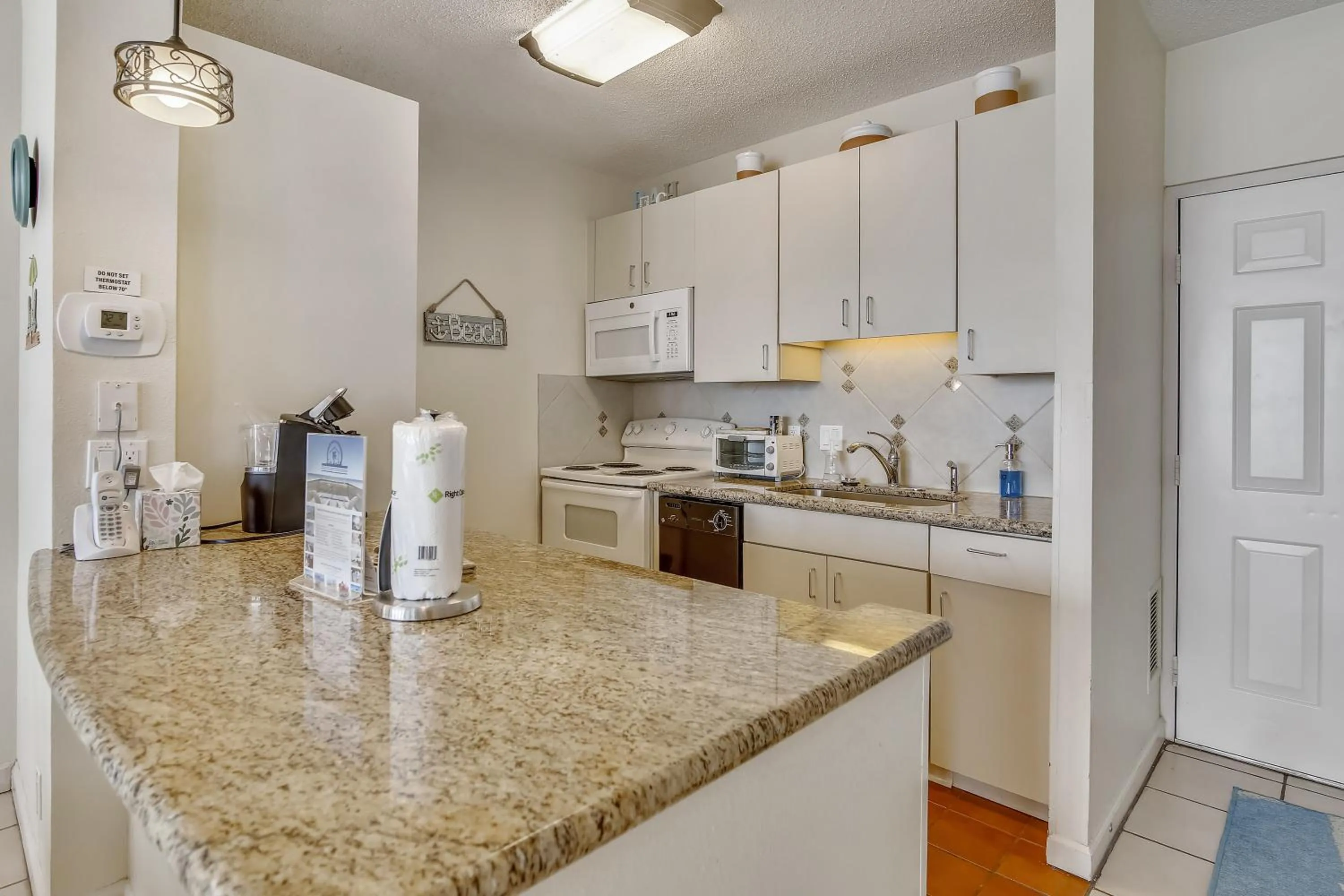 Kitchen or kitchenette in Galvestonian 1002-Beachfront Getaway