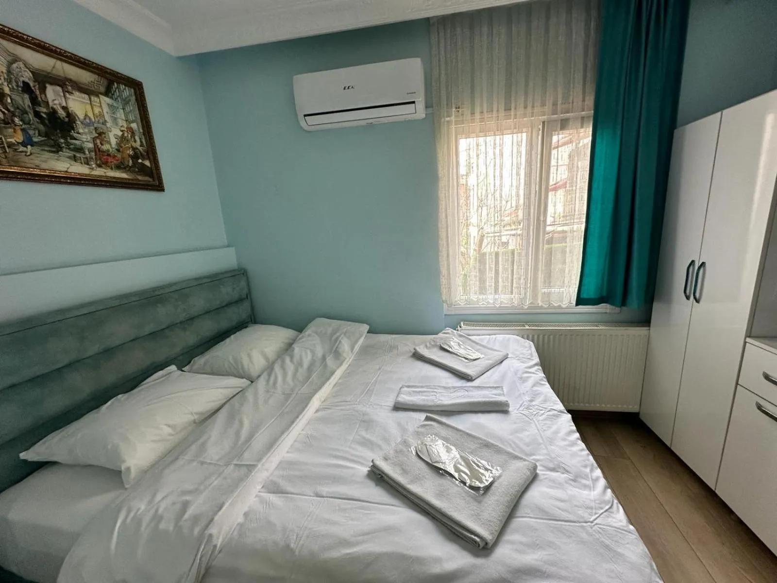 Bed in AVRASYAQUEEN HOTEL