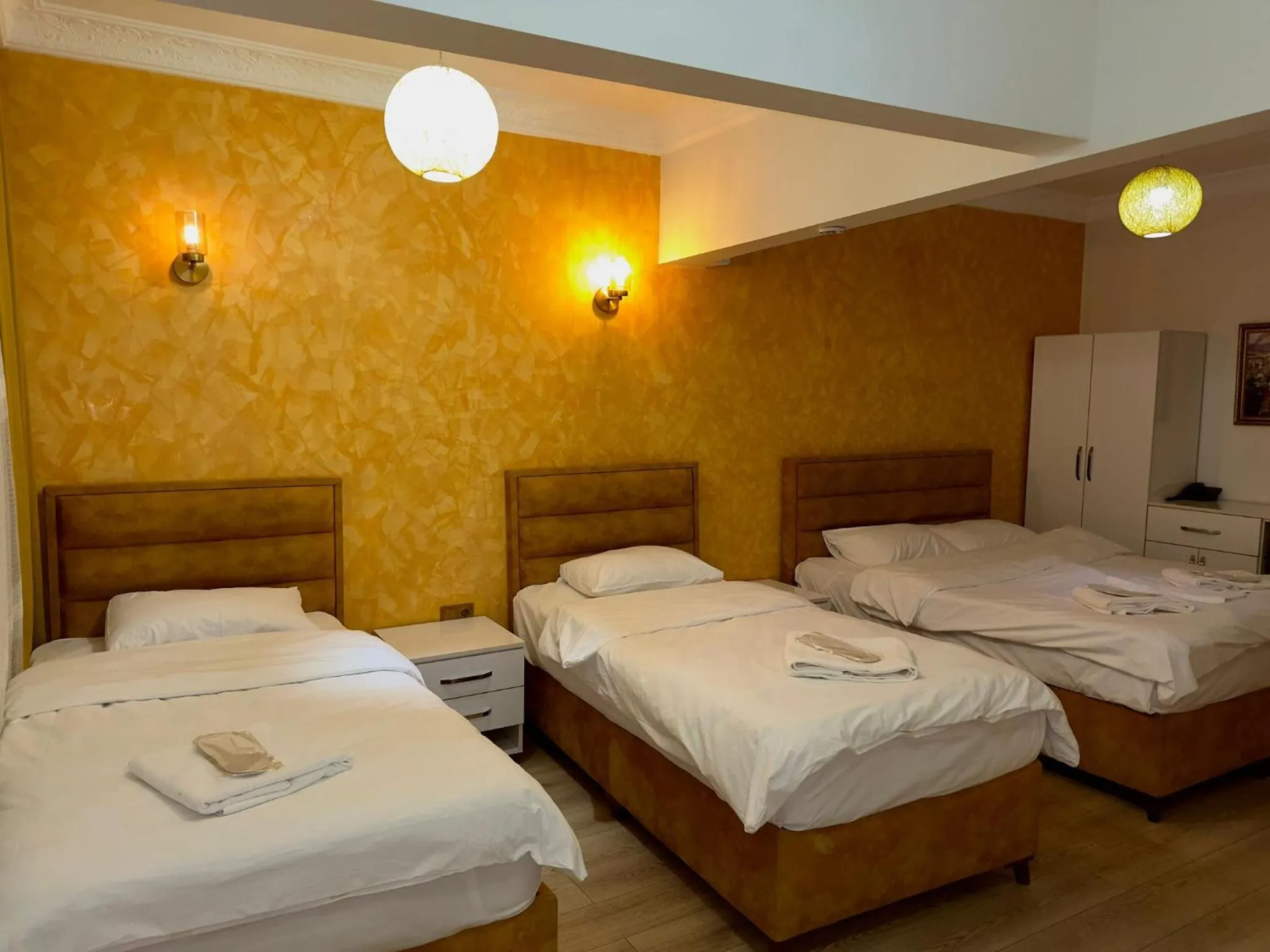 Bed in AVRASYAQUEEN HOTEL