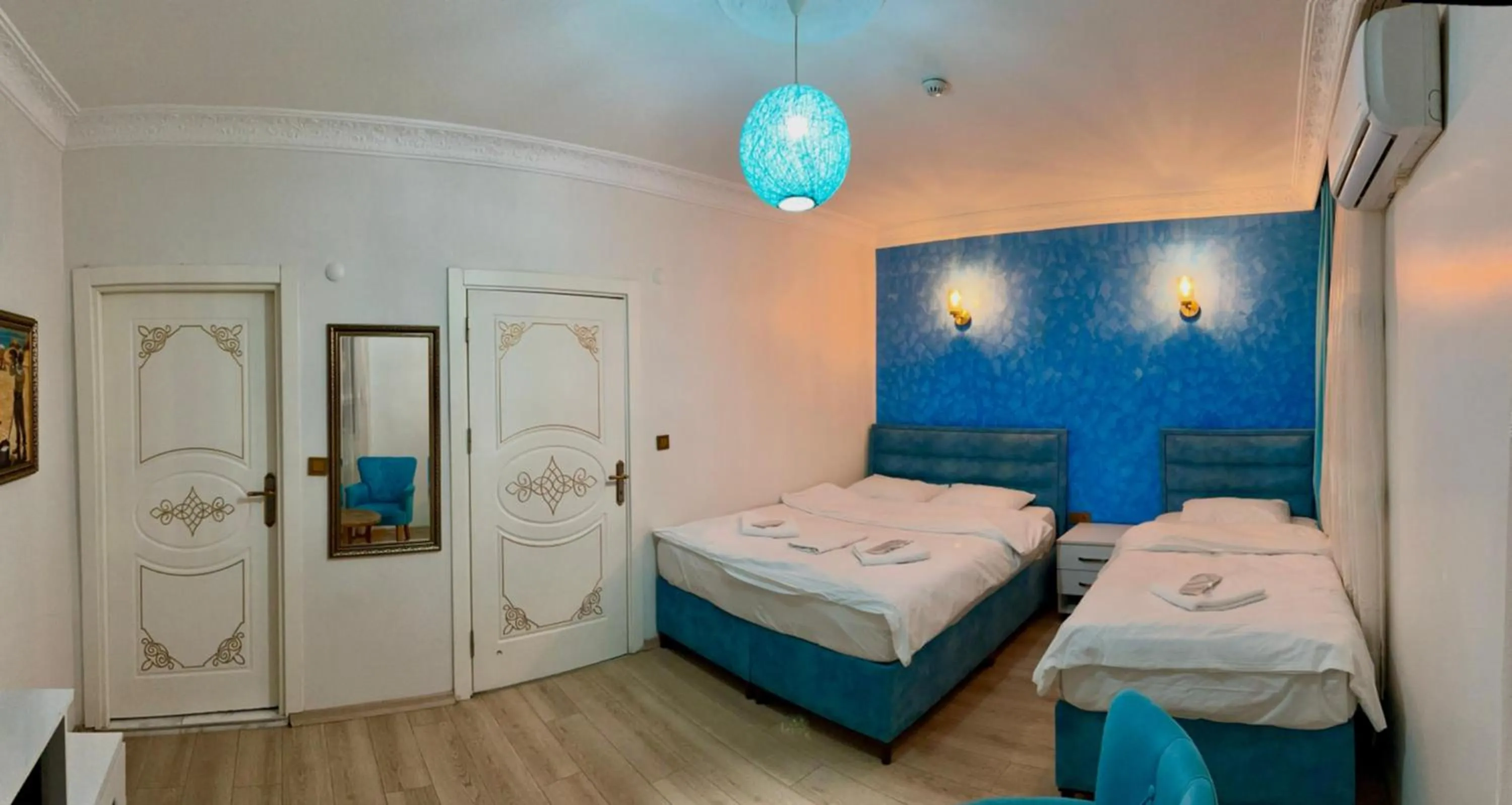 Bed in AVRASYAQUEEN HOTEL