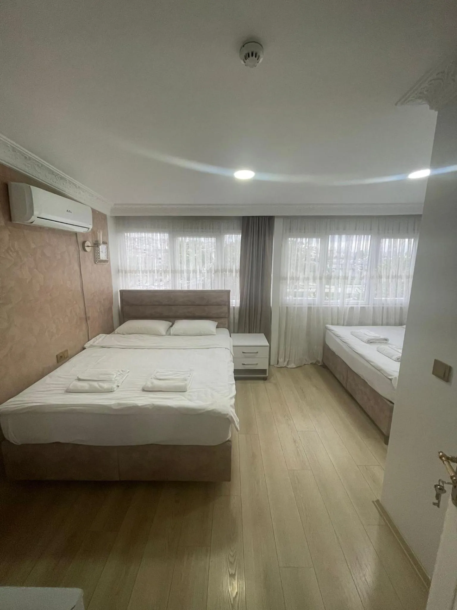 Bed in AVRASYAQUEEN HOTEL