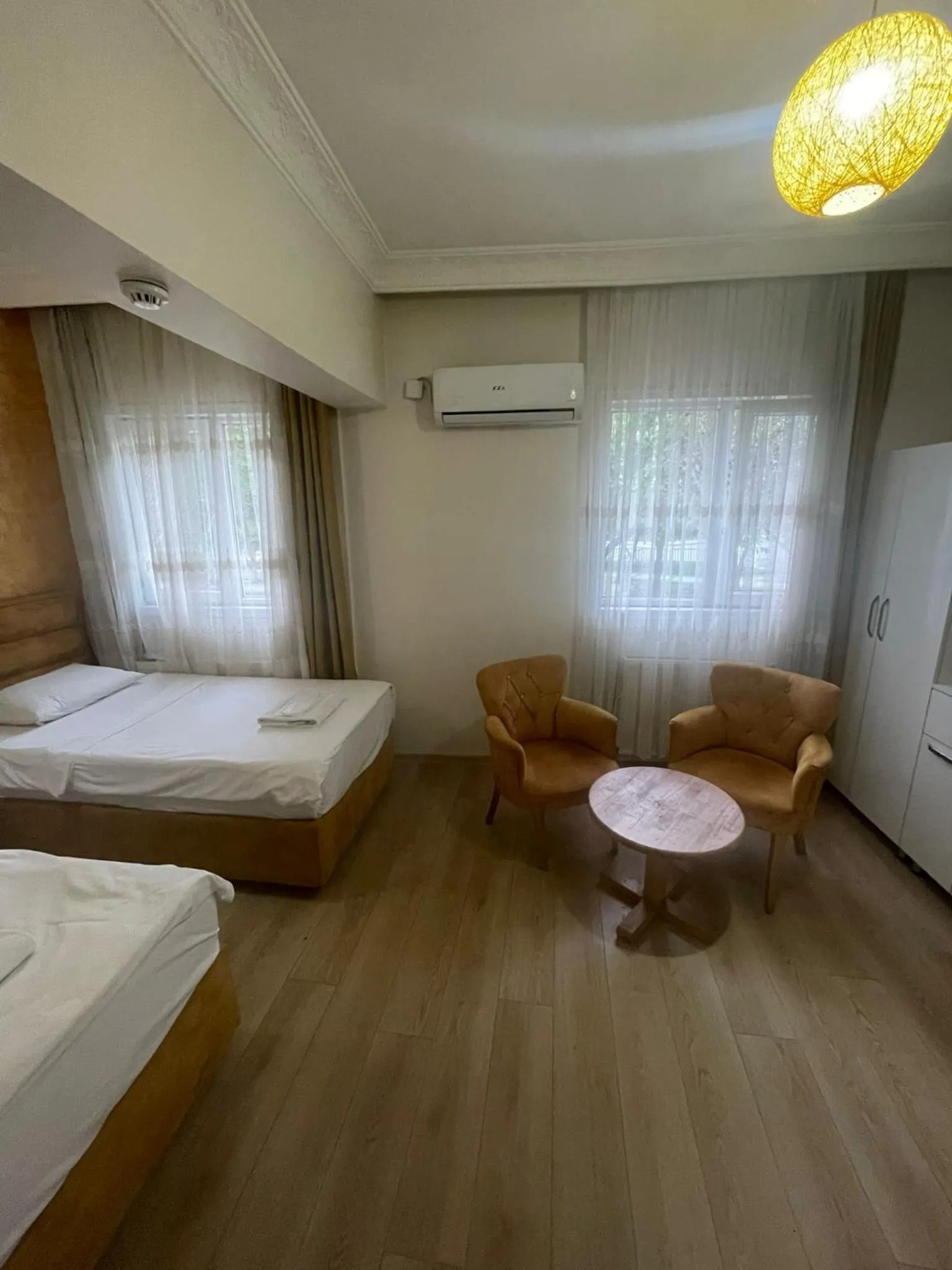 Bed in AVRASYAQUEEN HOTEL