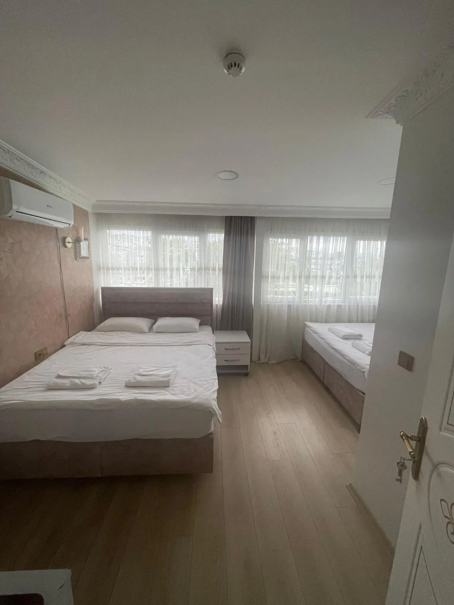 Bed in AVRASYAQUEEN HOTEL