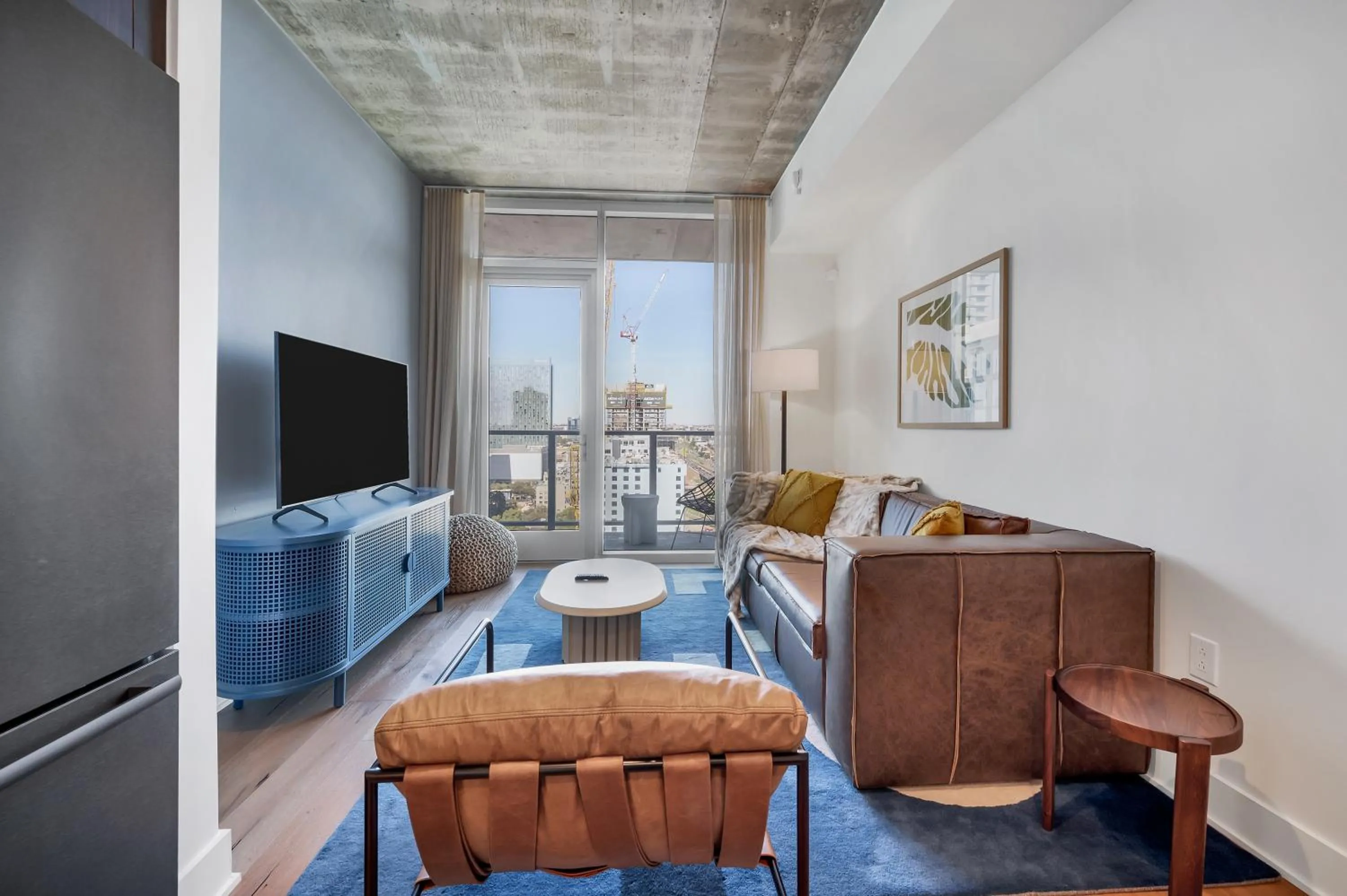 Seating area in Upscale Rainey St Condo Homes - Peloton, gym, rooftop pool, wifi included