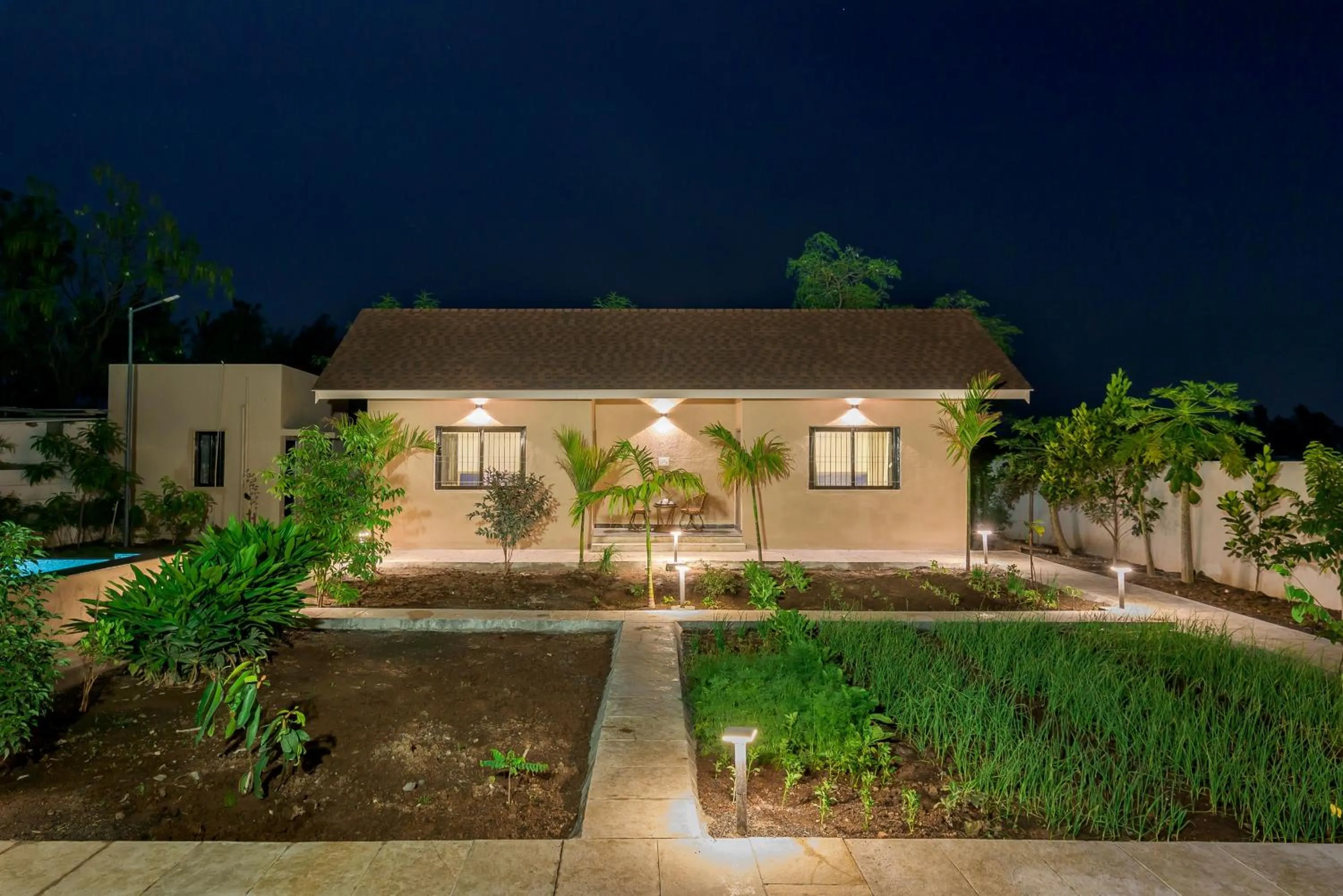 Property building in SaffronStays Eden - 3BR vineyard-side pool villa with jacuzzi, farm dining, stargazing deck & lawns for celebrations