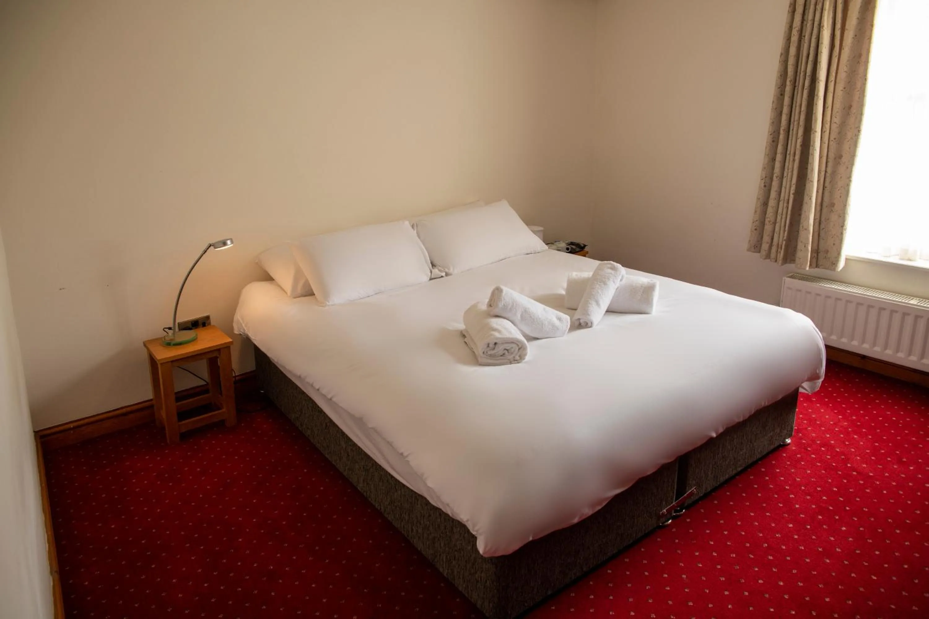 Bed in The Knighton Apartment