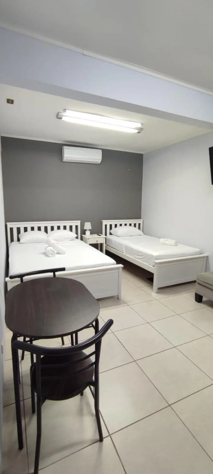 Bed in Coati Arenal Lodge