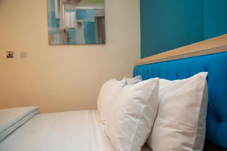 Bed in Macoba Luxury Apartments