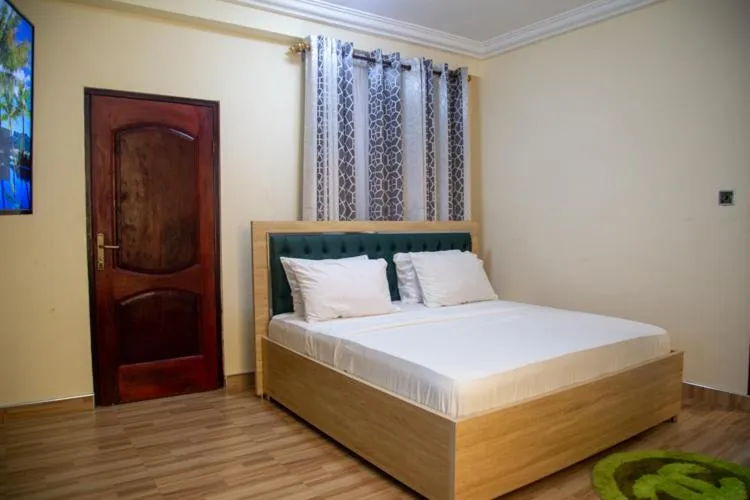 Bed in Macoba Luxury Apartments