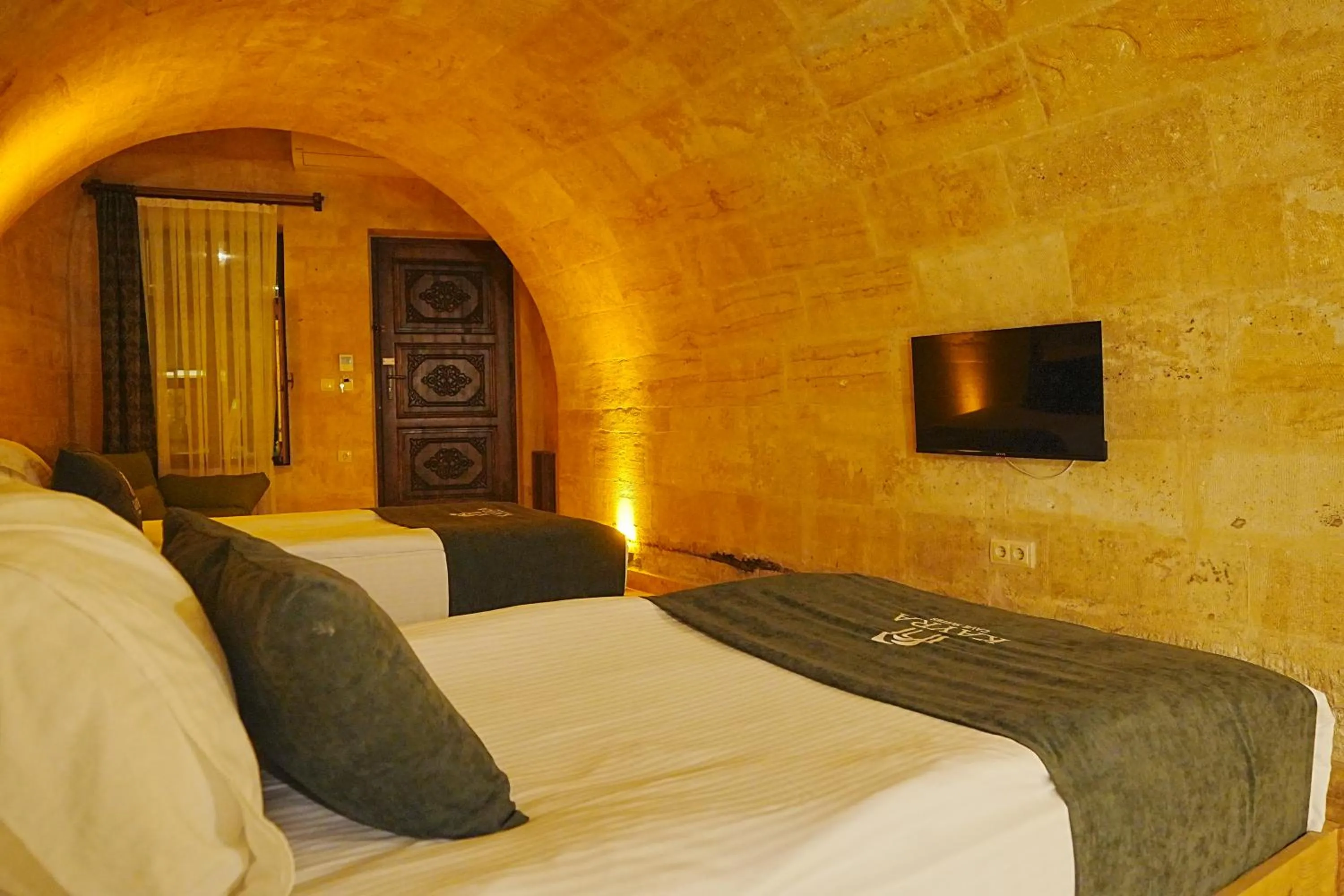 Bed in Kayra Cave Suites