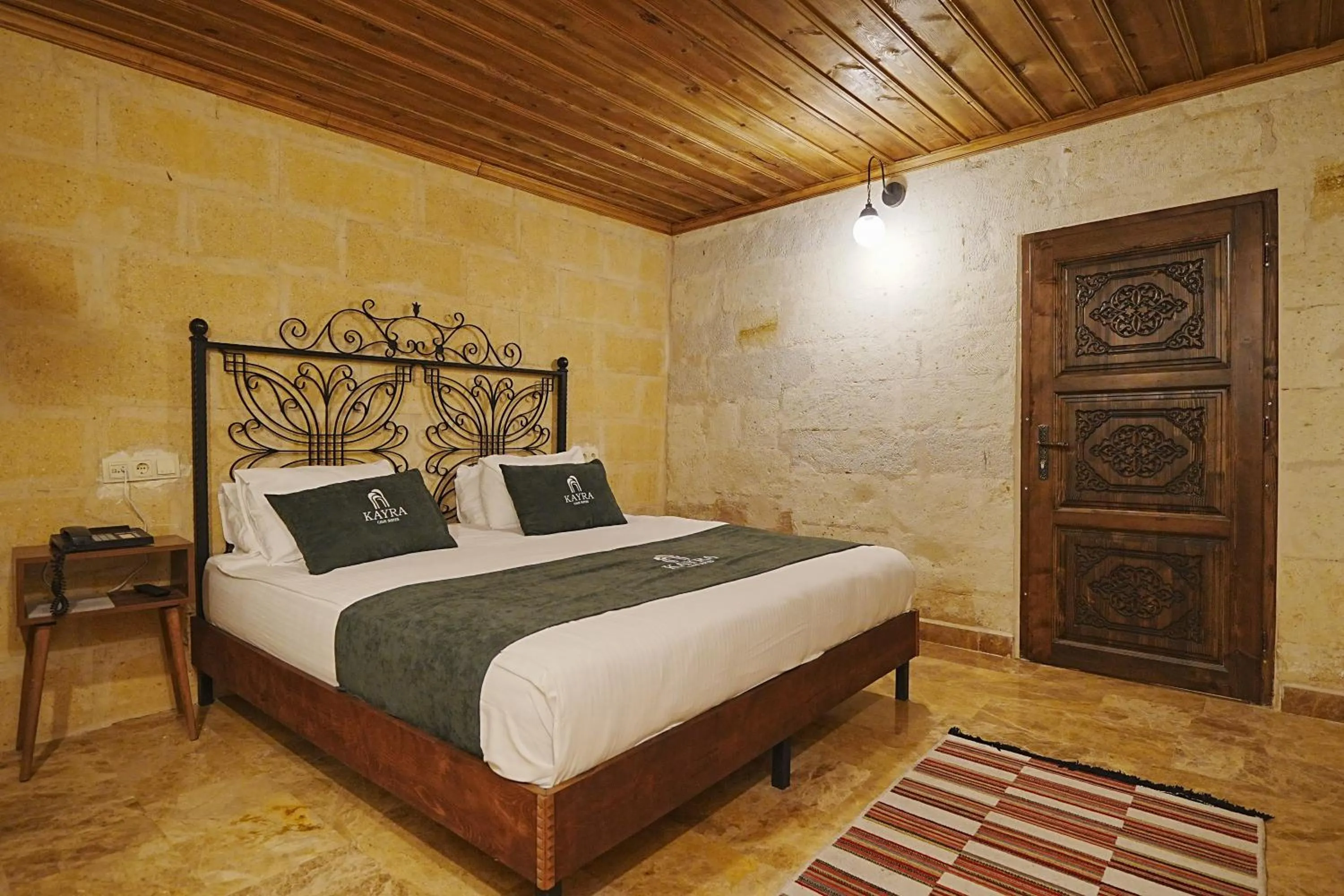 Bed in Kayra Cave Suites