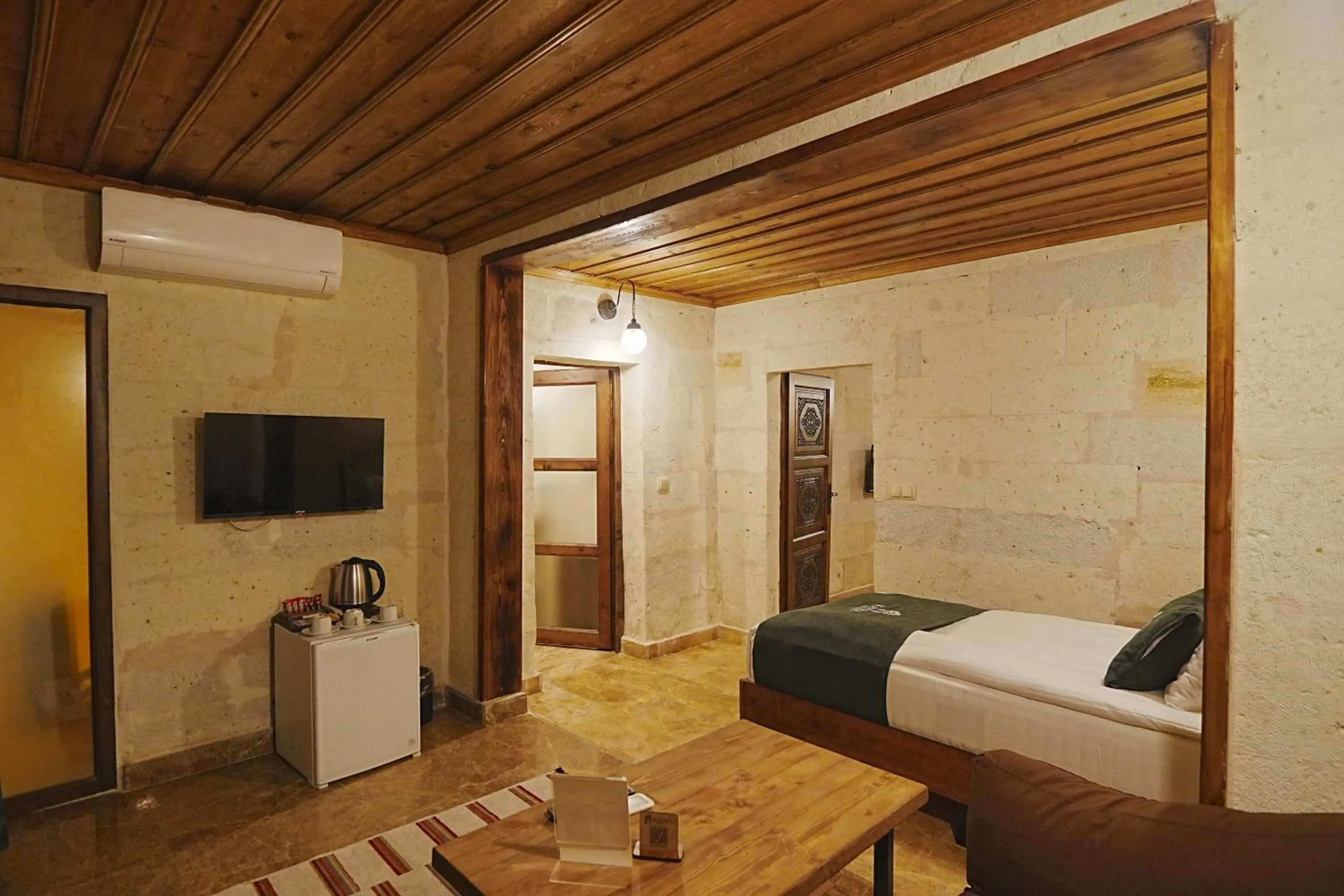 Bed in Kayra Cave Suites